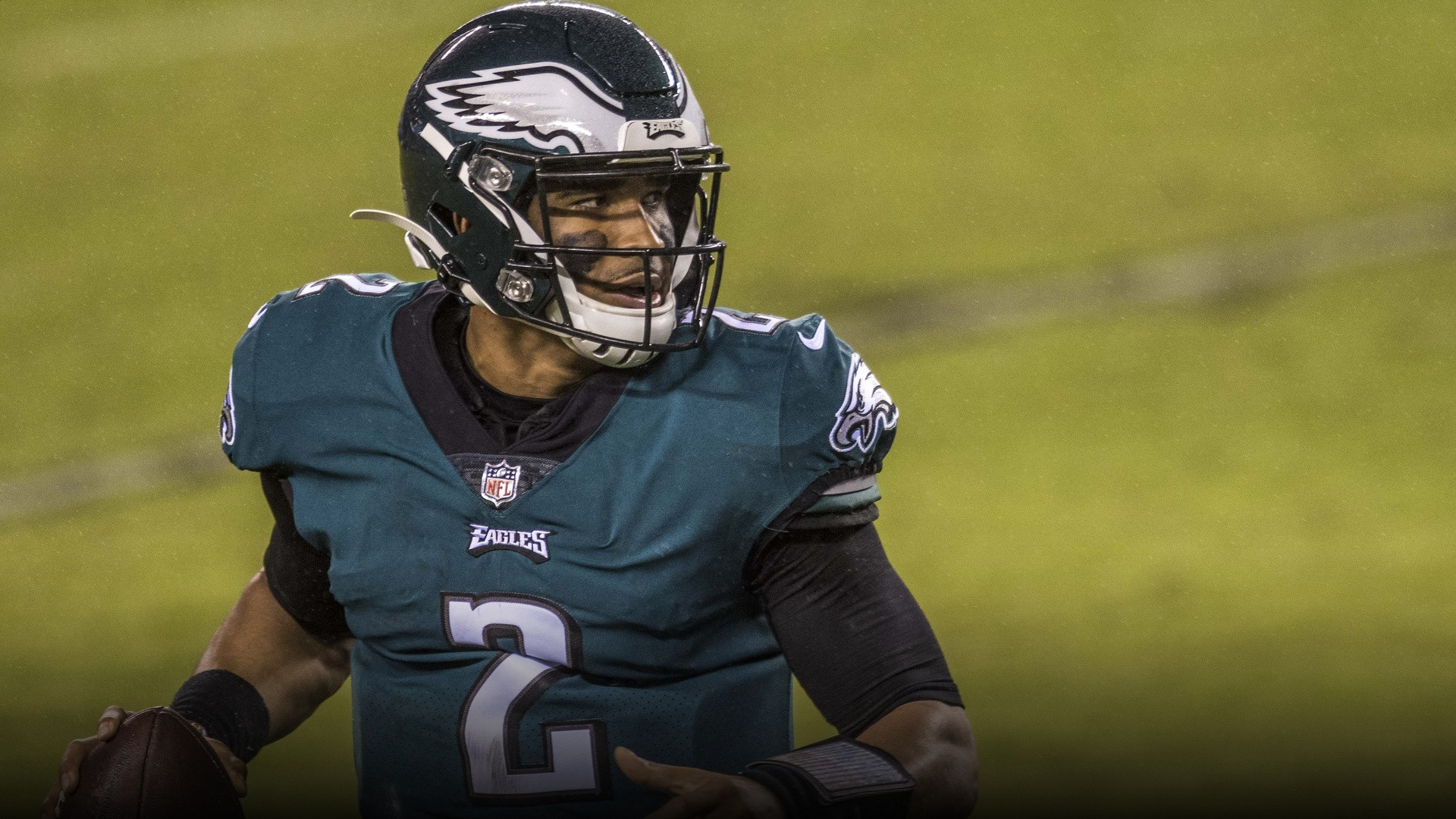 Jalen Hurts scrambling with the football during an NFL game.