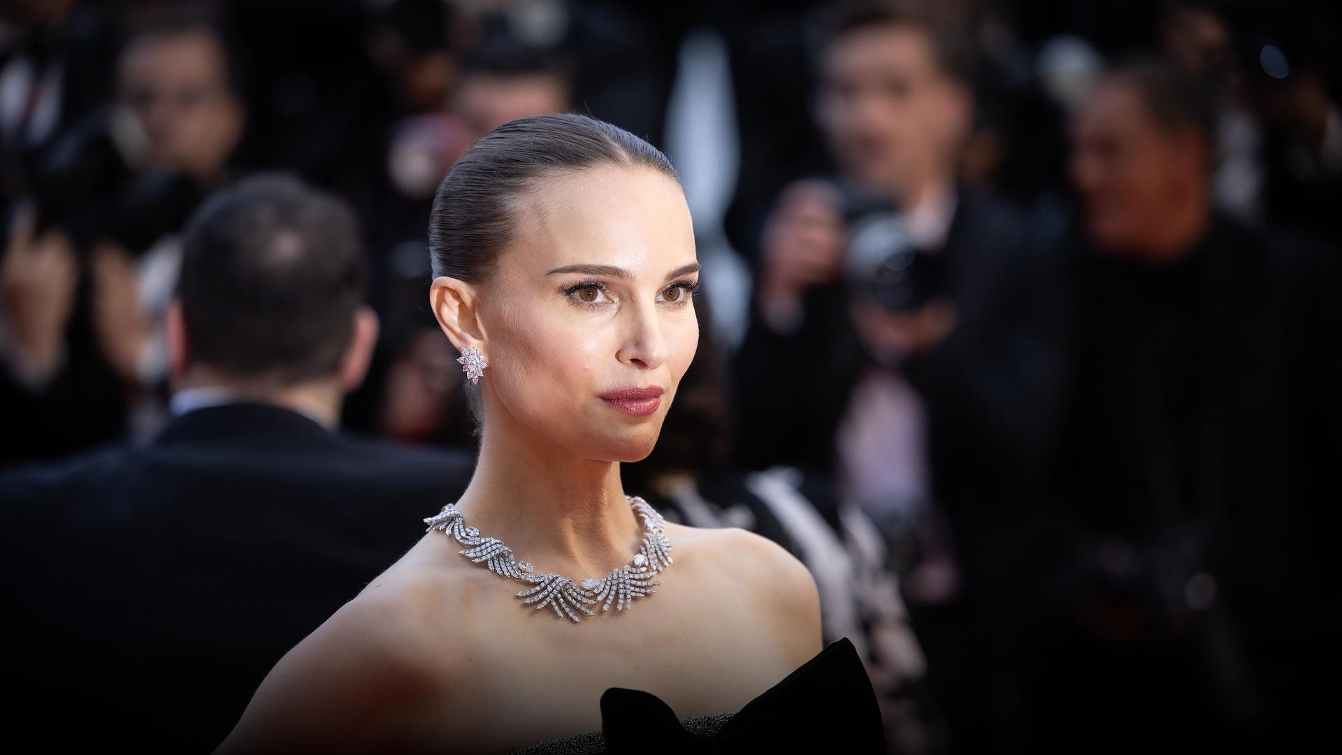 High-resolution portrait photograph of Natalie Portman celebrating academic achievement.