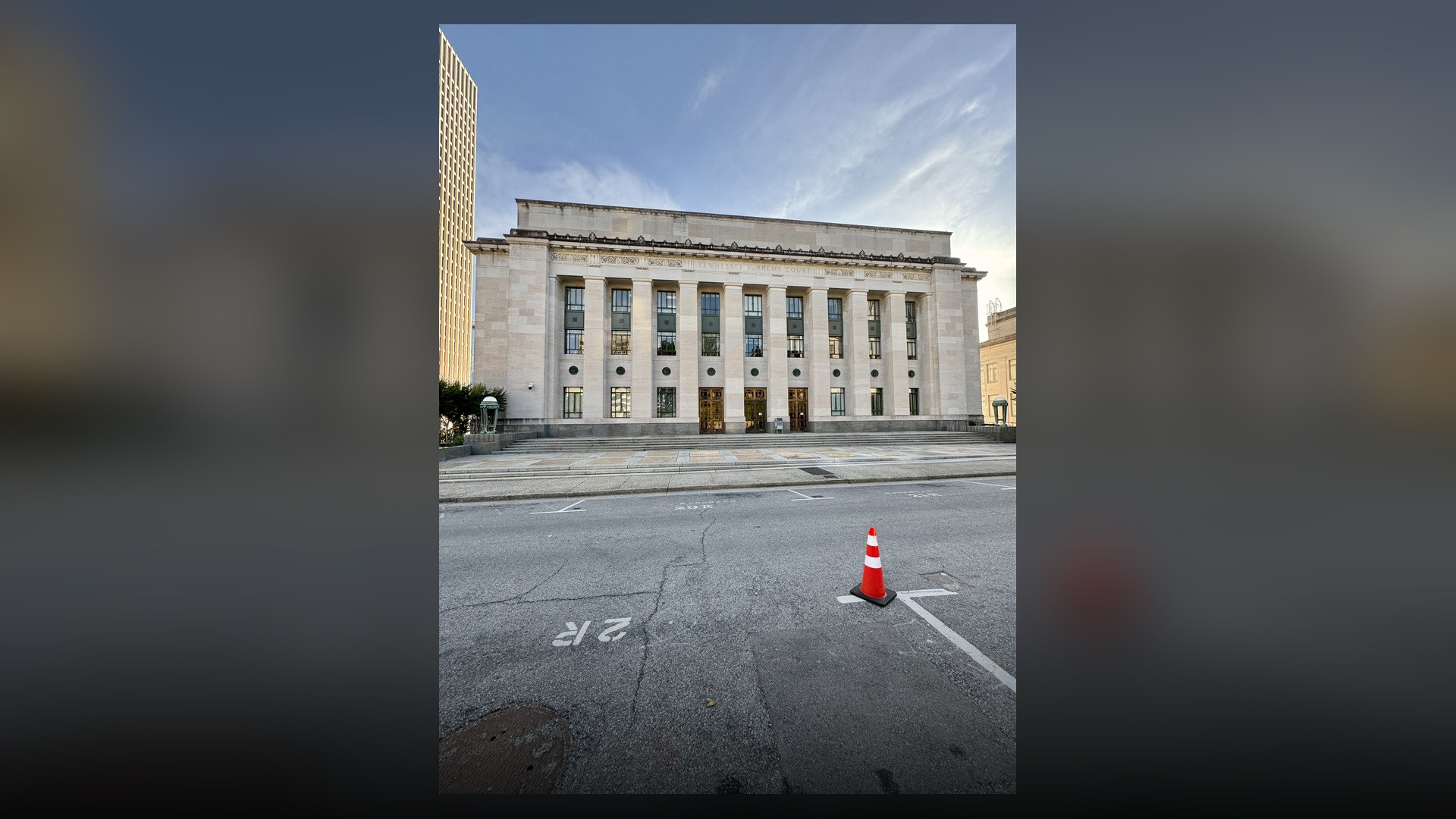 The majestic limestone columns and portico entrance of the Tennessee Supreme Court Building in Nashville.