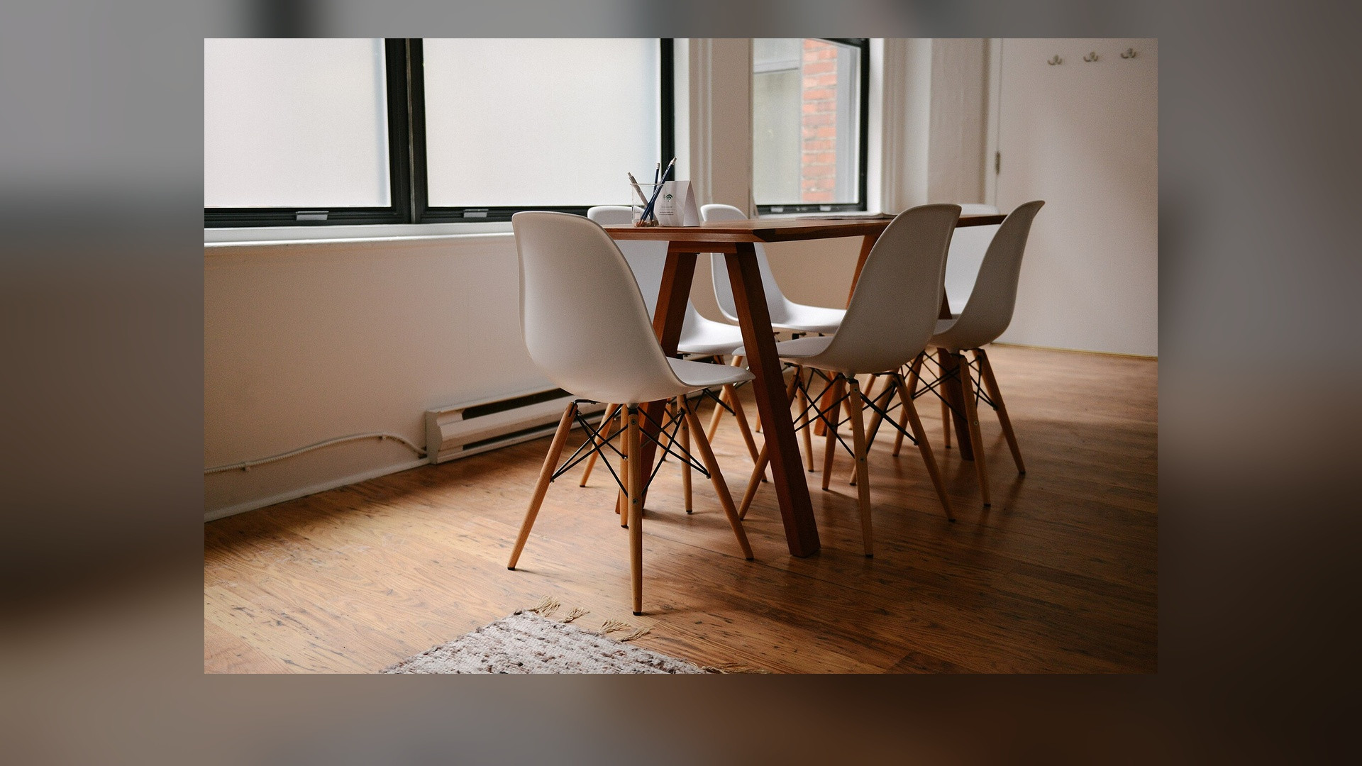 Modern executive boardroom table and conference room chairs.