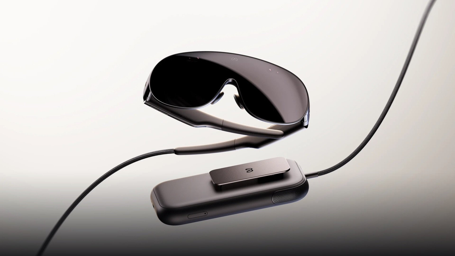 Meta VR Glasses hovering above the pocket compute puck highlighting the featherlight glasses profile.