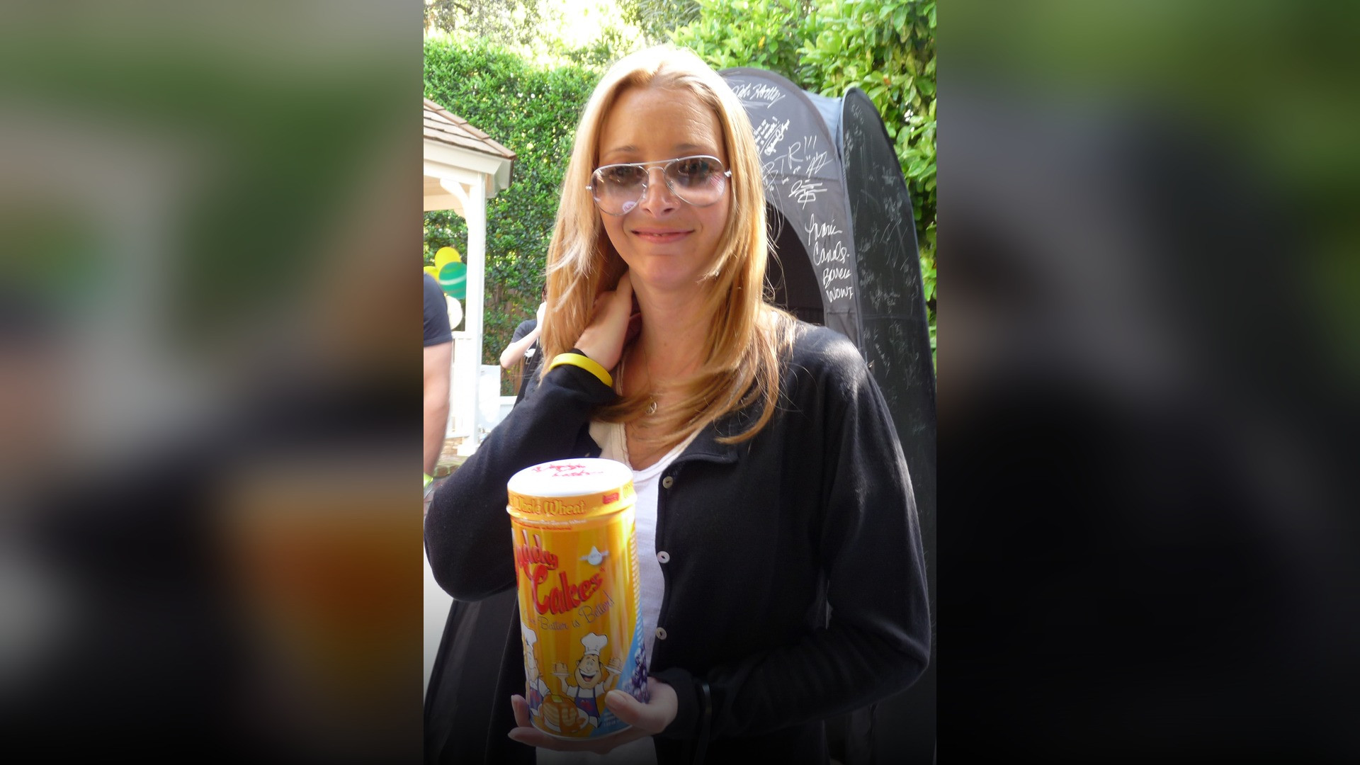 High-resolution portrait photograph of Lisa Kudrow celebrating academic achievement.