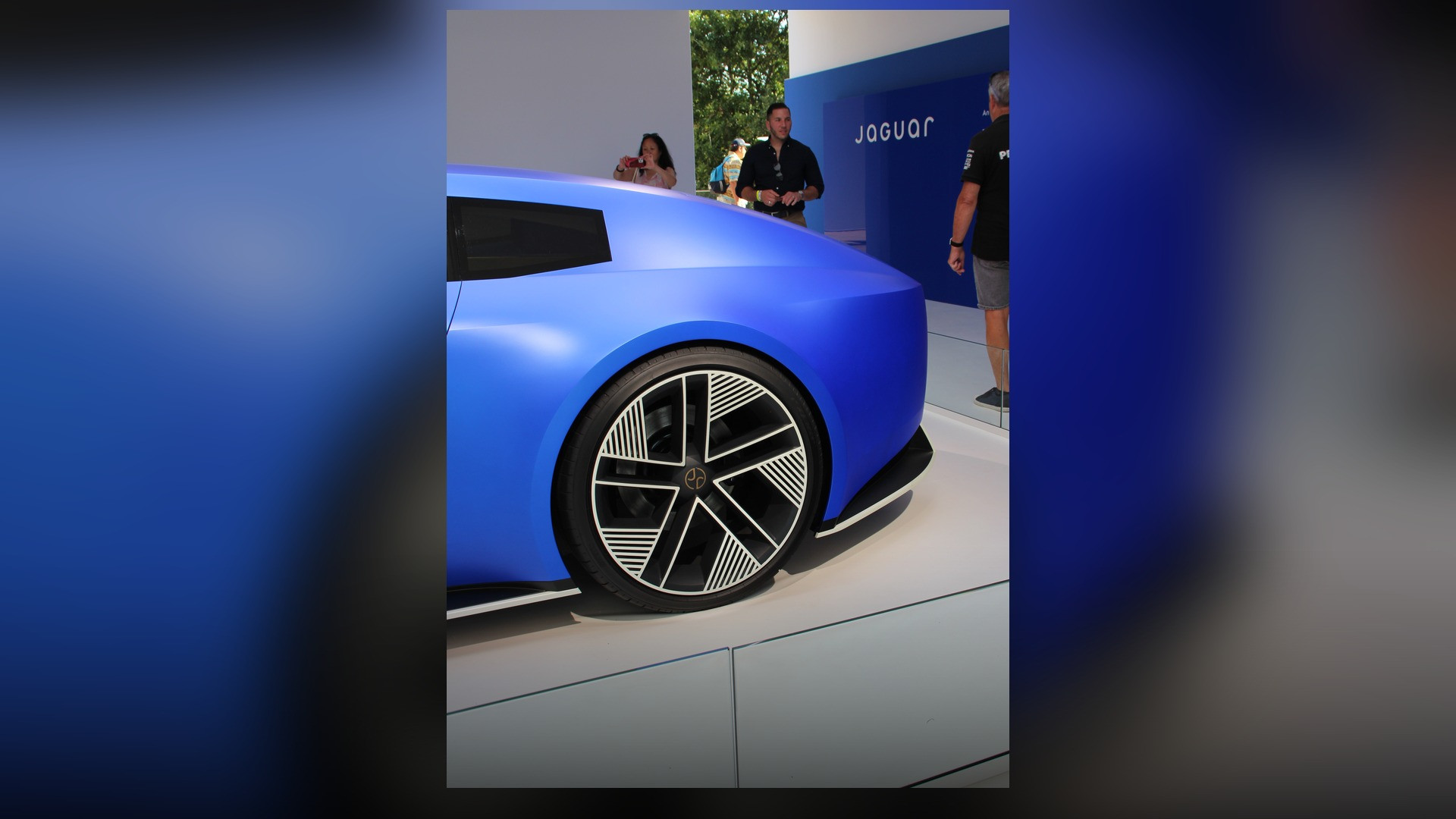 Rear three-quarter perspective highlighting the wide muscular haunches and wheels of the Jaguar Type 00.