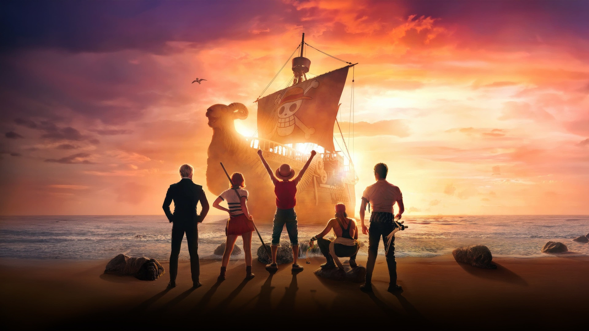 Iñaki Godoy as Monkey D. Luffy raising his fist with the Straw Hat pirates aboard the Going Merry.