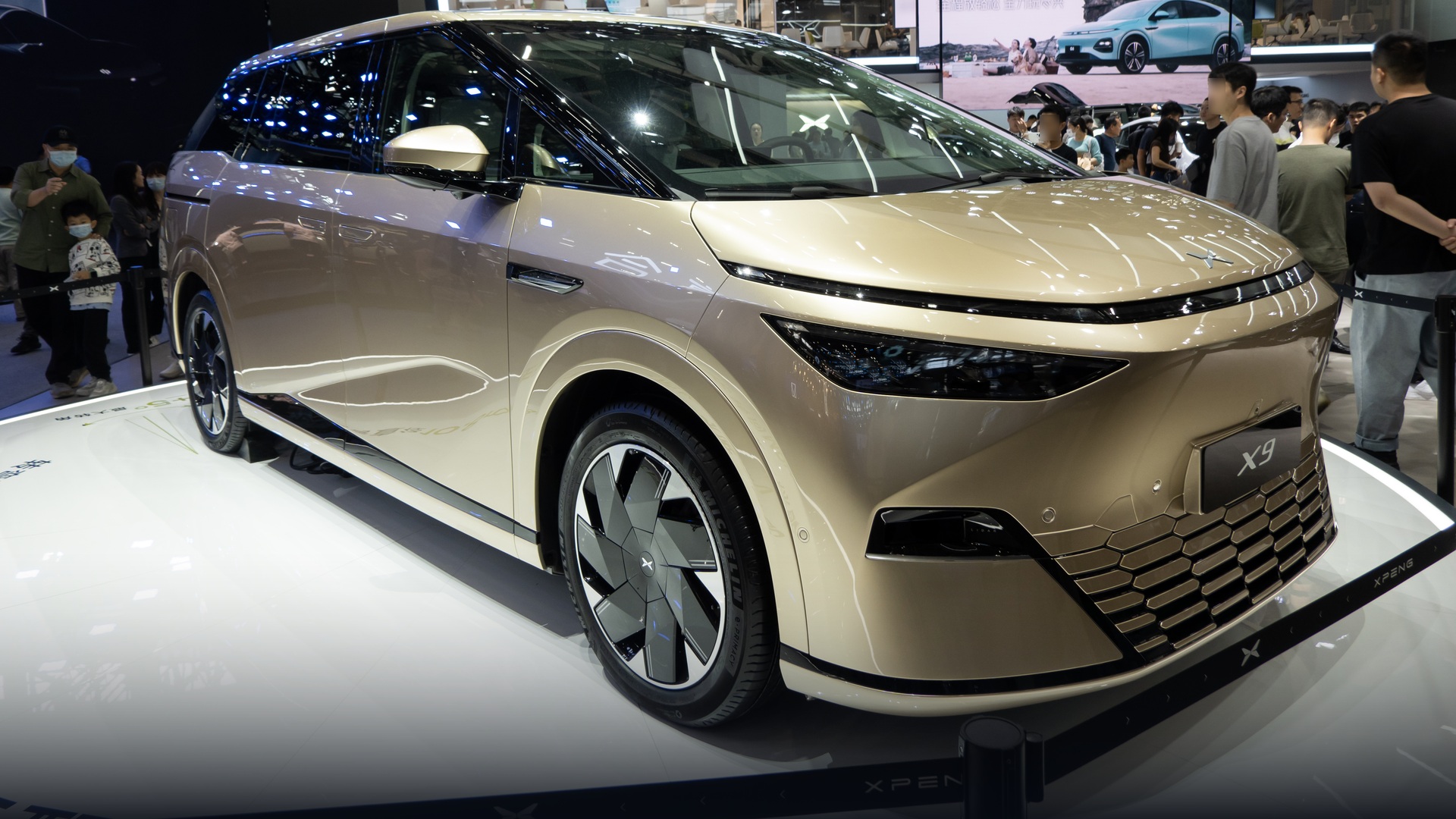 Starship-styled XPeng X9 intelligent electric flagship on Auto Guangzhou exhibition stage.