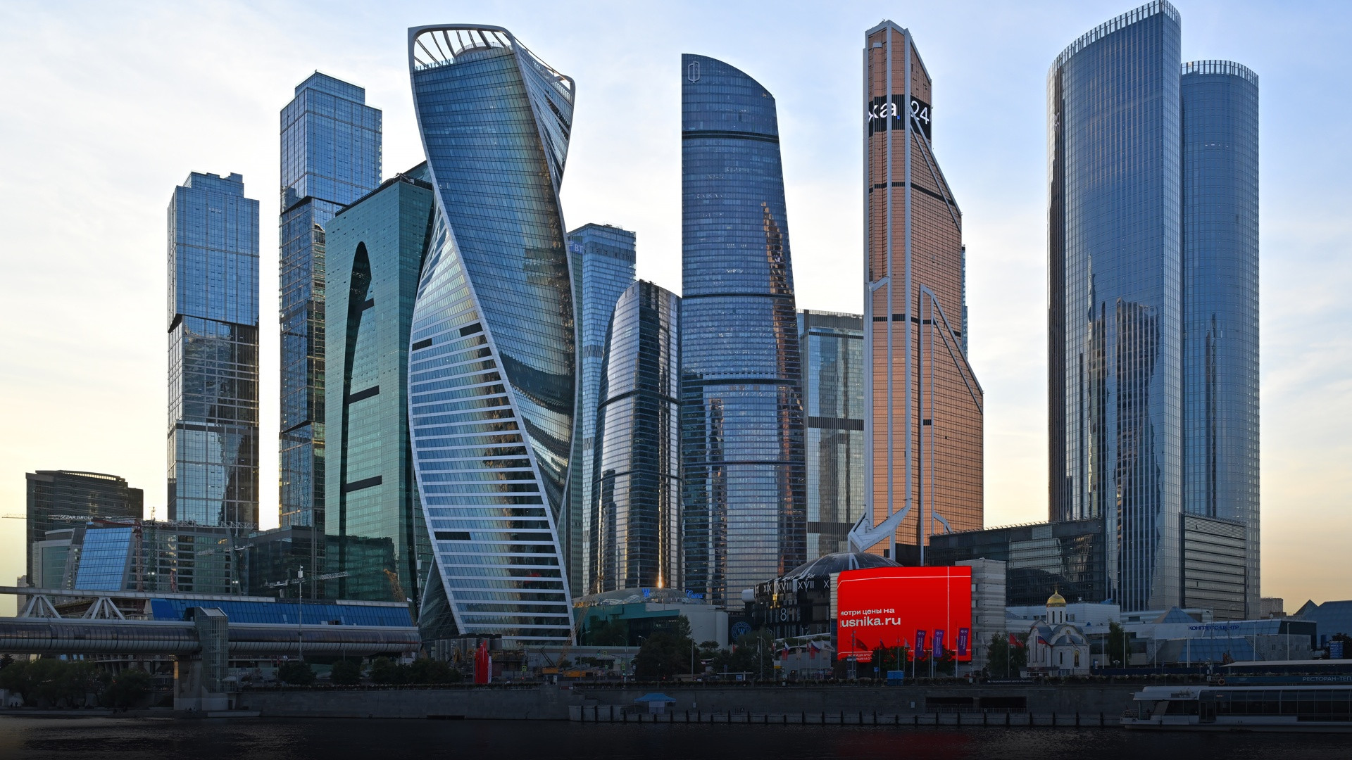 Moscow International Business Center skyline gleaming during a dramatic late summer sunset.