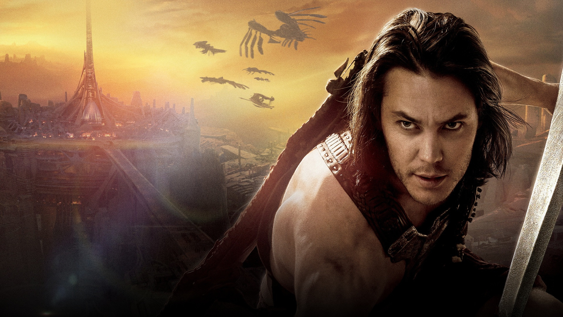 Taylor Kitsch as John Carter ready for combat with sword drawn on the red plains of Mars.