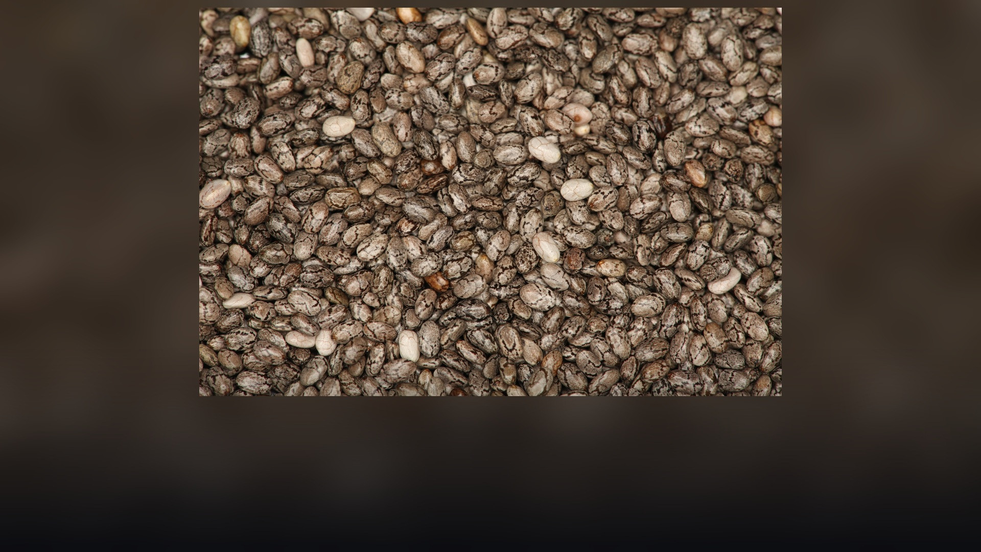 Detailed macro photograph of nutrient-dense black and gray chia seeds.
