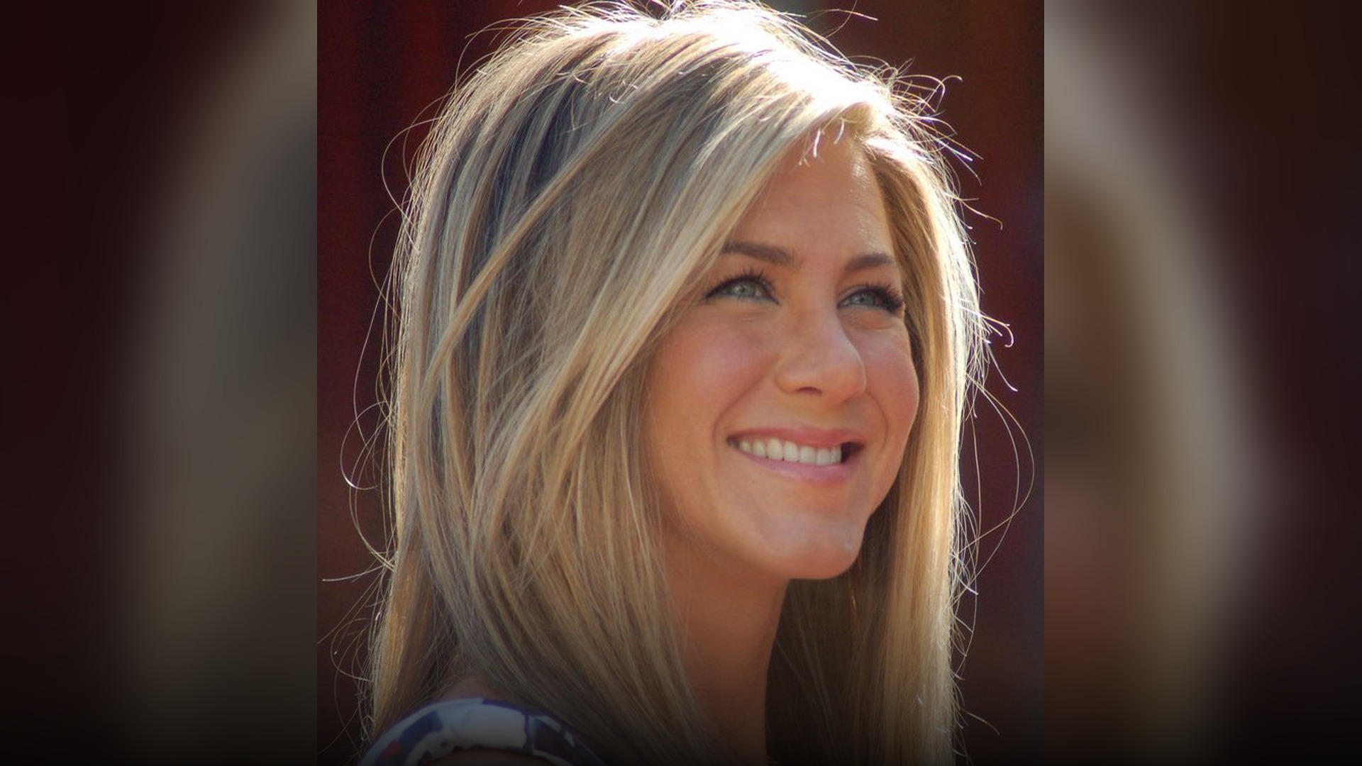 Jennifer Aniston signing autographs for fans at a movie premiere