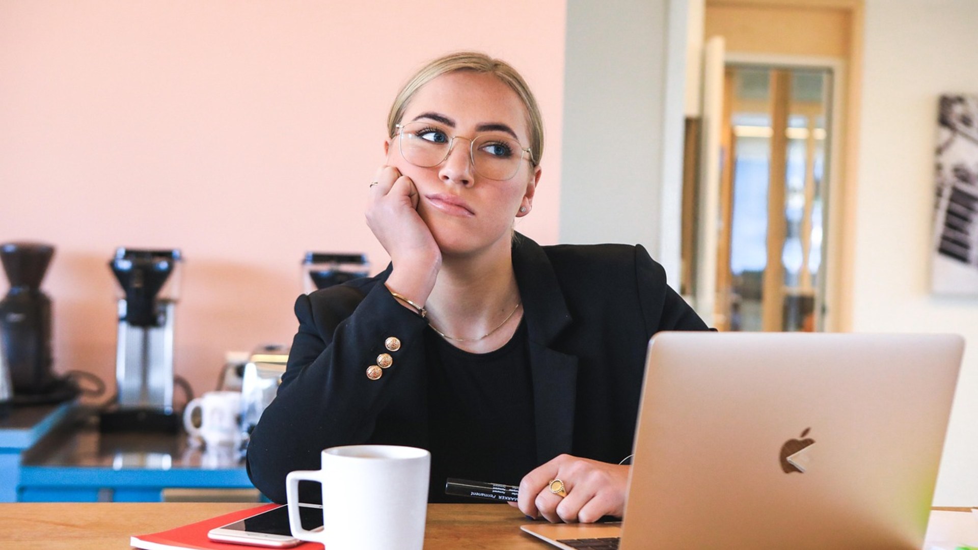 Woman looking bored and dismissive at an office desk