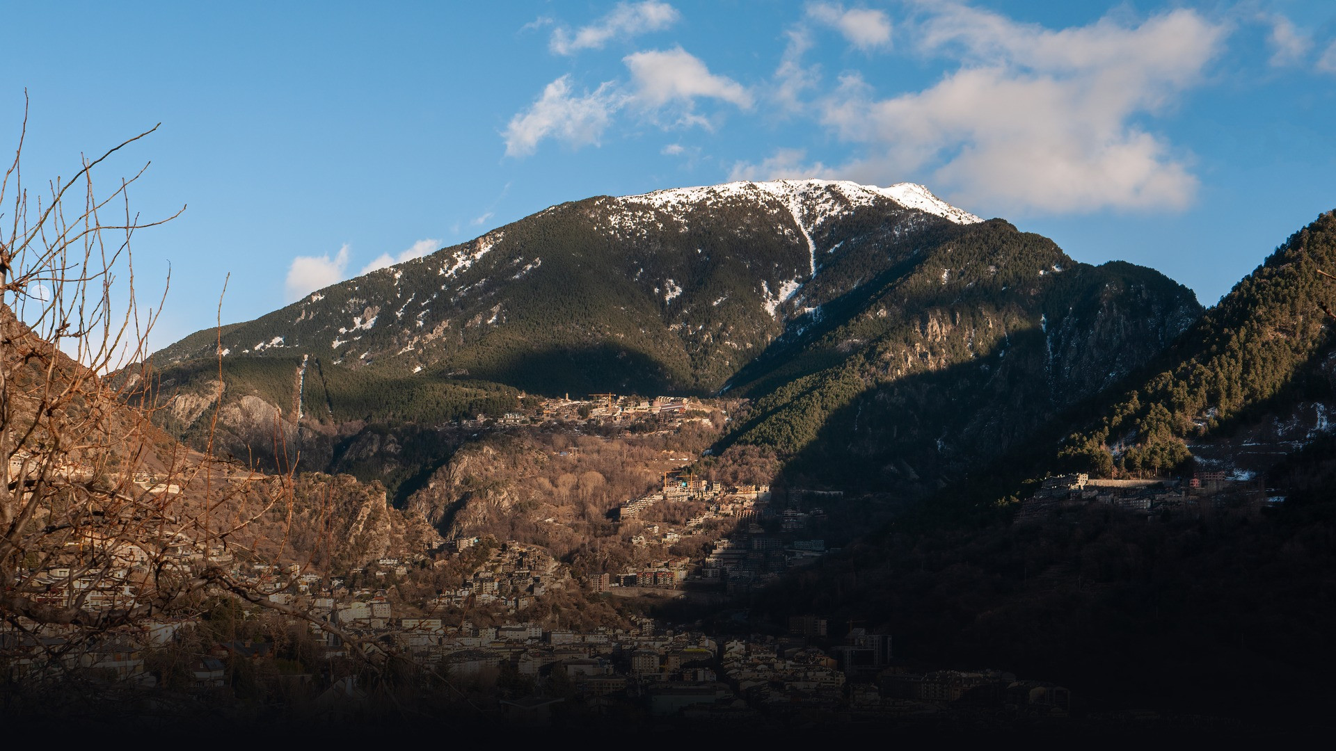 Scenic mountain town of Andorra la Vella surrounded by rugged Pyrenean peaks.