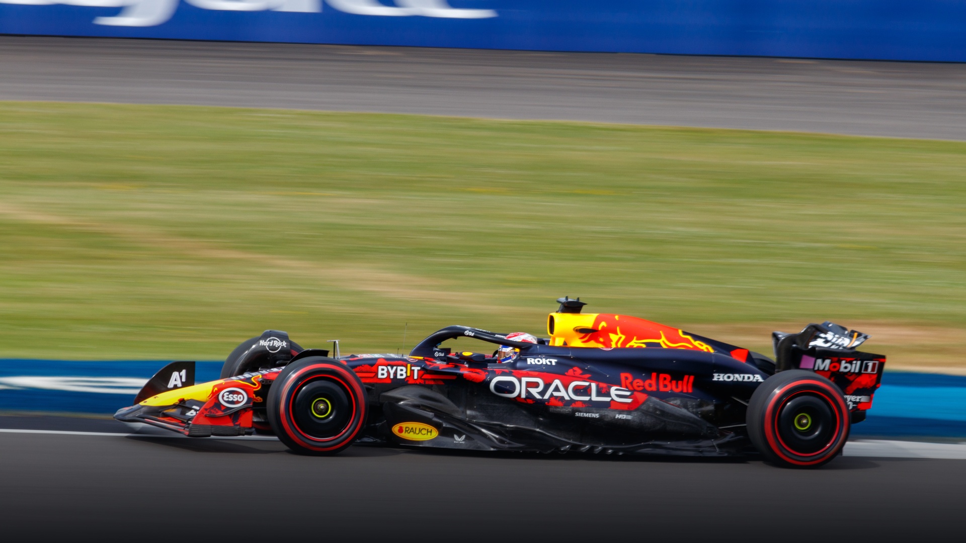 Max Verstappen attacking a corner in his Red Bull Racing RB20 during the 2024 European season.