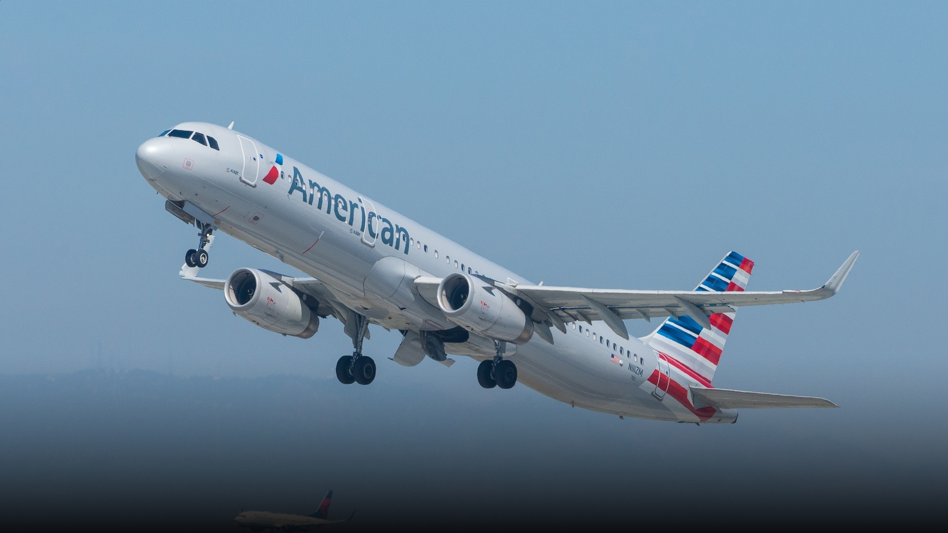 American Airlines commercial passenger jet on the airport tarmac.