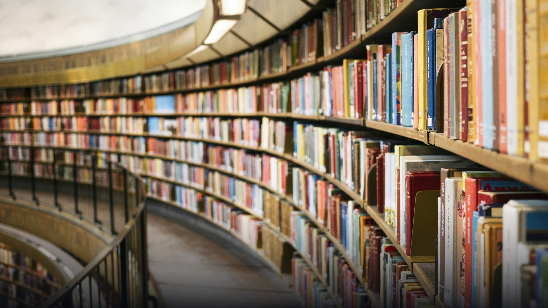 Extensive law library bookshelves and warm reading lamps under arched historic ceilings.