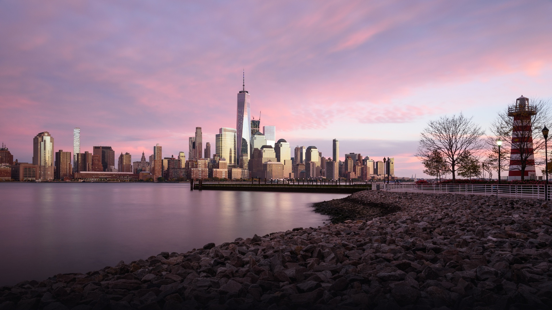 Panoramic view of Lower Manhattan financial skyline from across the Hudson River.