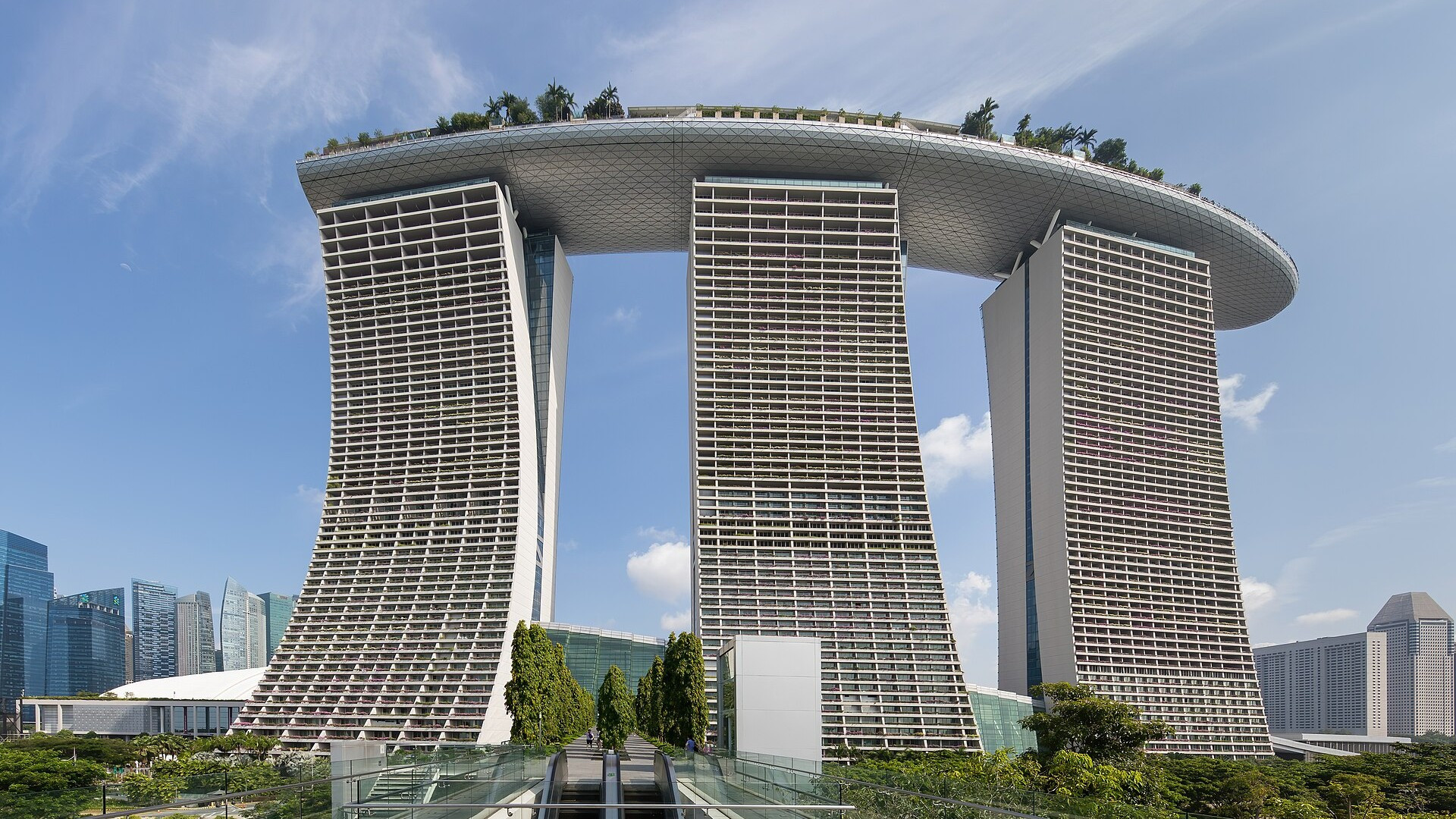The iconic three soaring towers and rooftop SkyPark surfboard of Marina Bay Sands in Singapore.