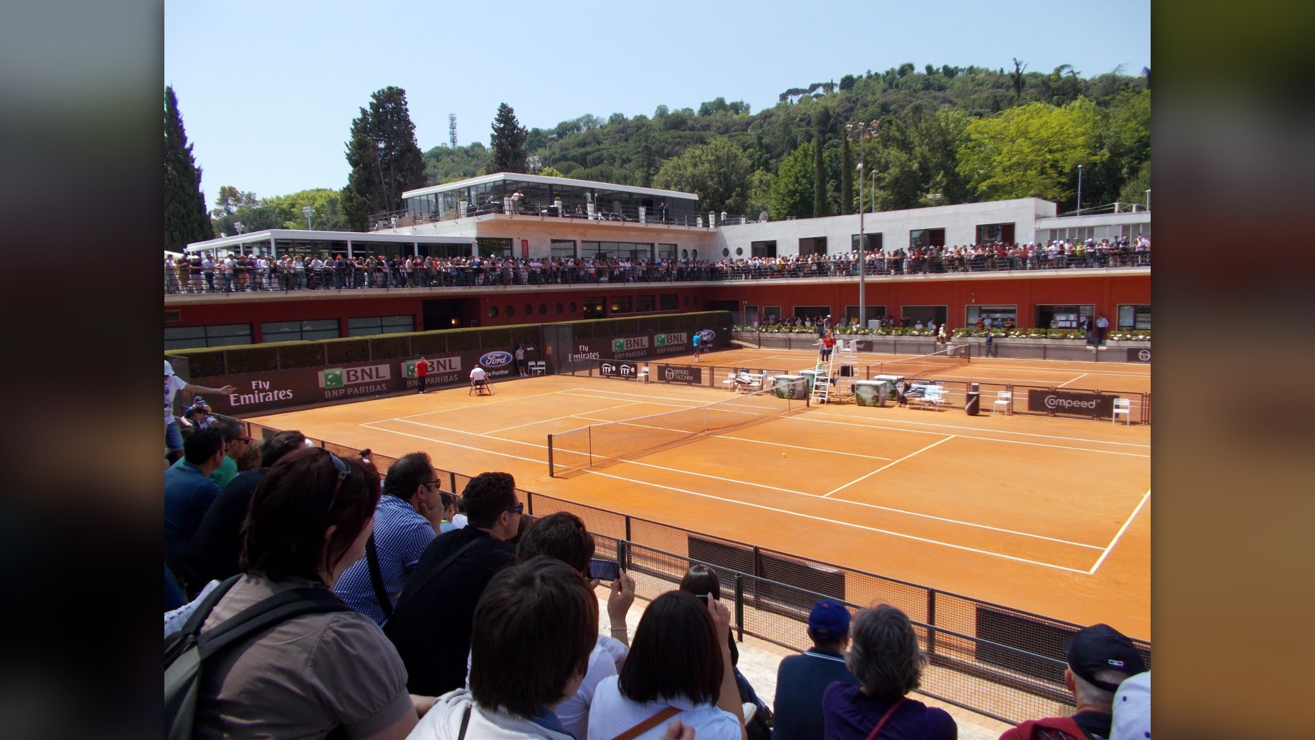 Red clay tennis courts at the Foro Italico complex in Rome, Italy