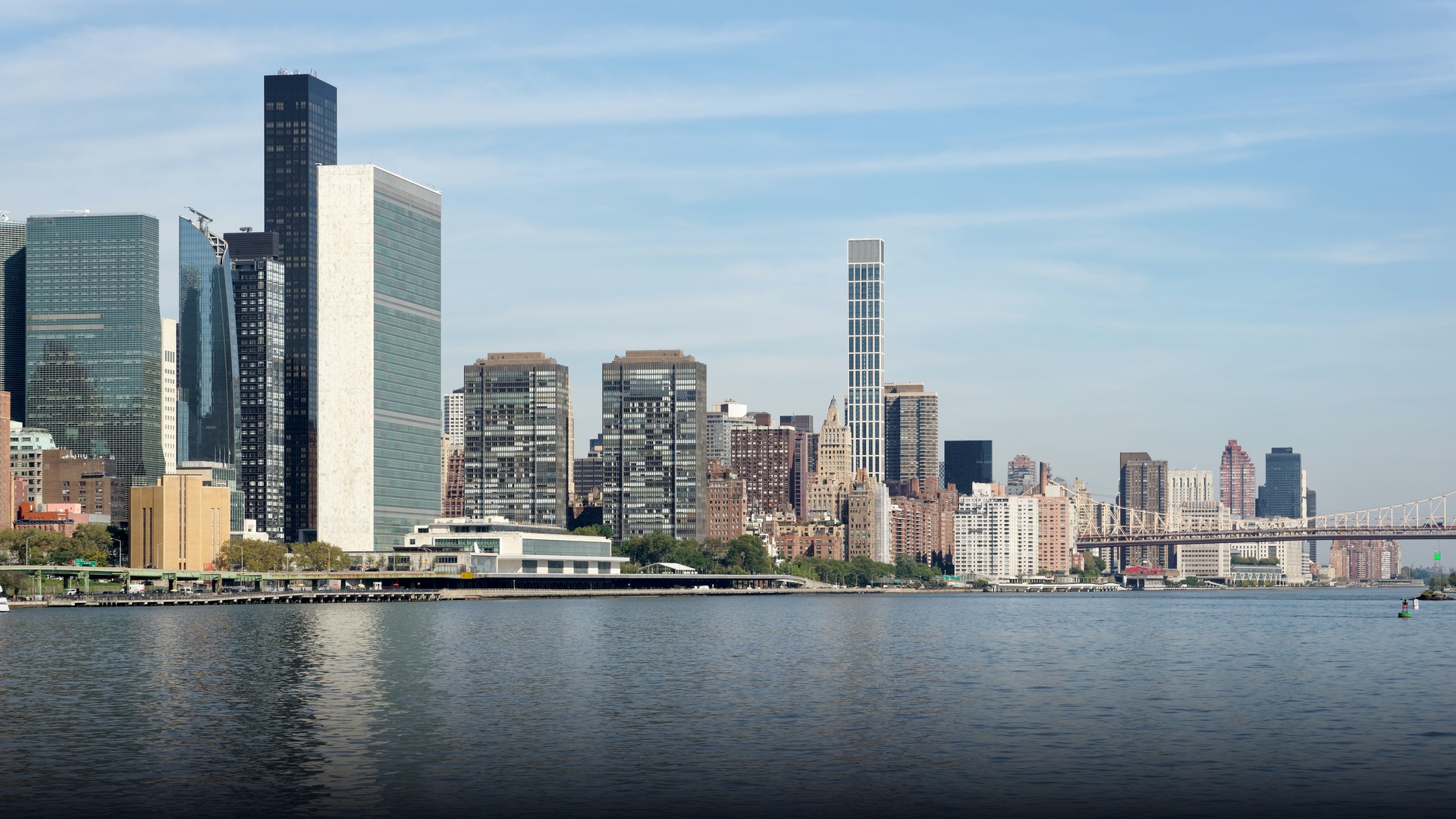 Panoramic view of the United Nations Headquarters complex across the East River.