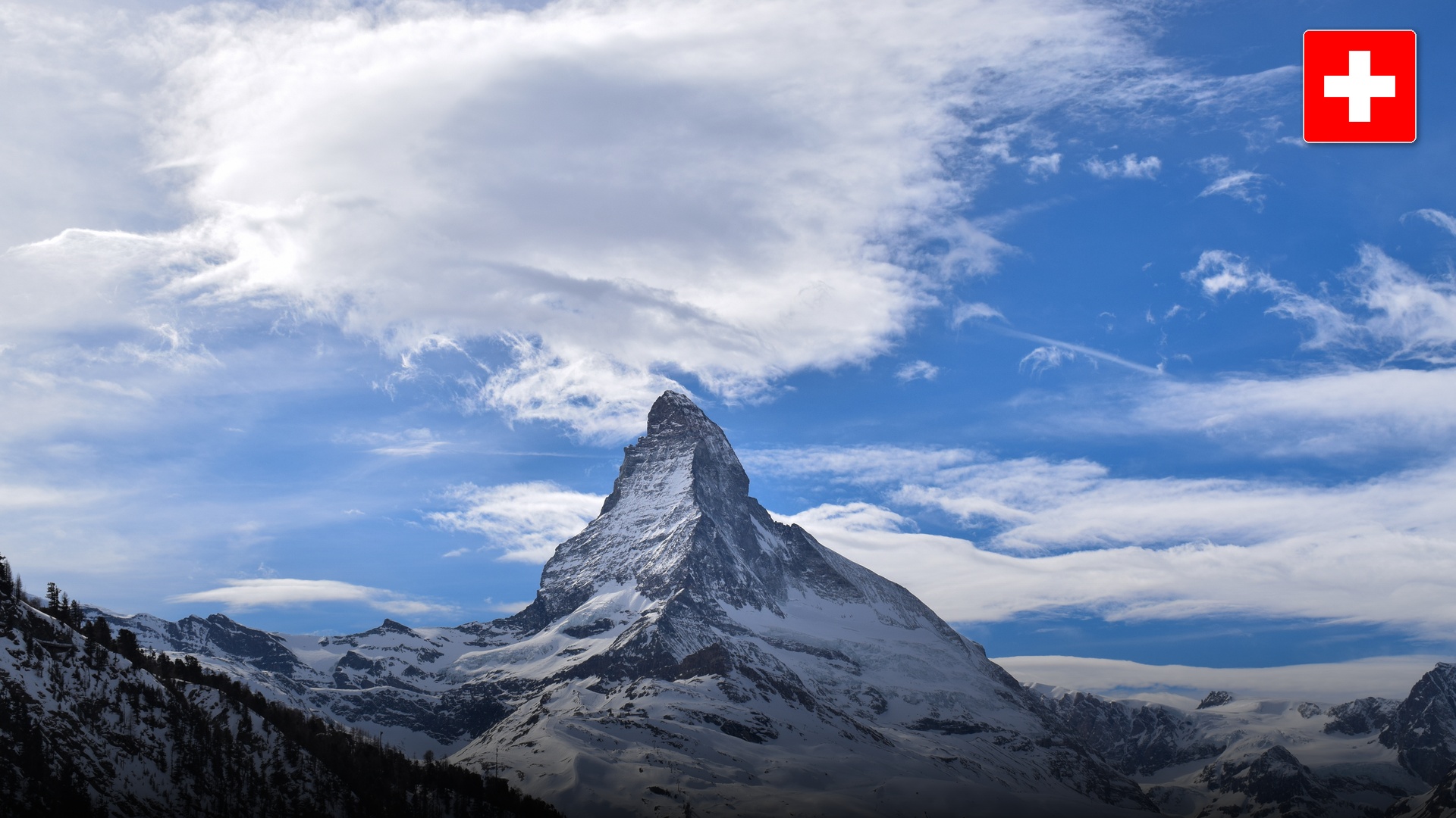 The Matterhorn peak towering over the clear reflective surface of the alpine Riffelsee lake.