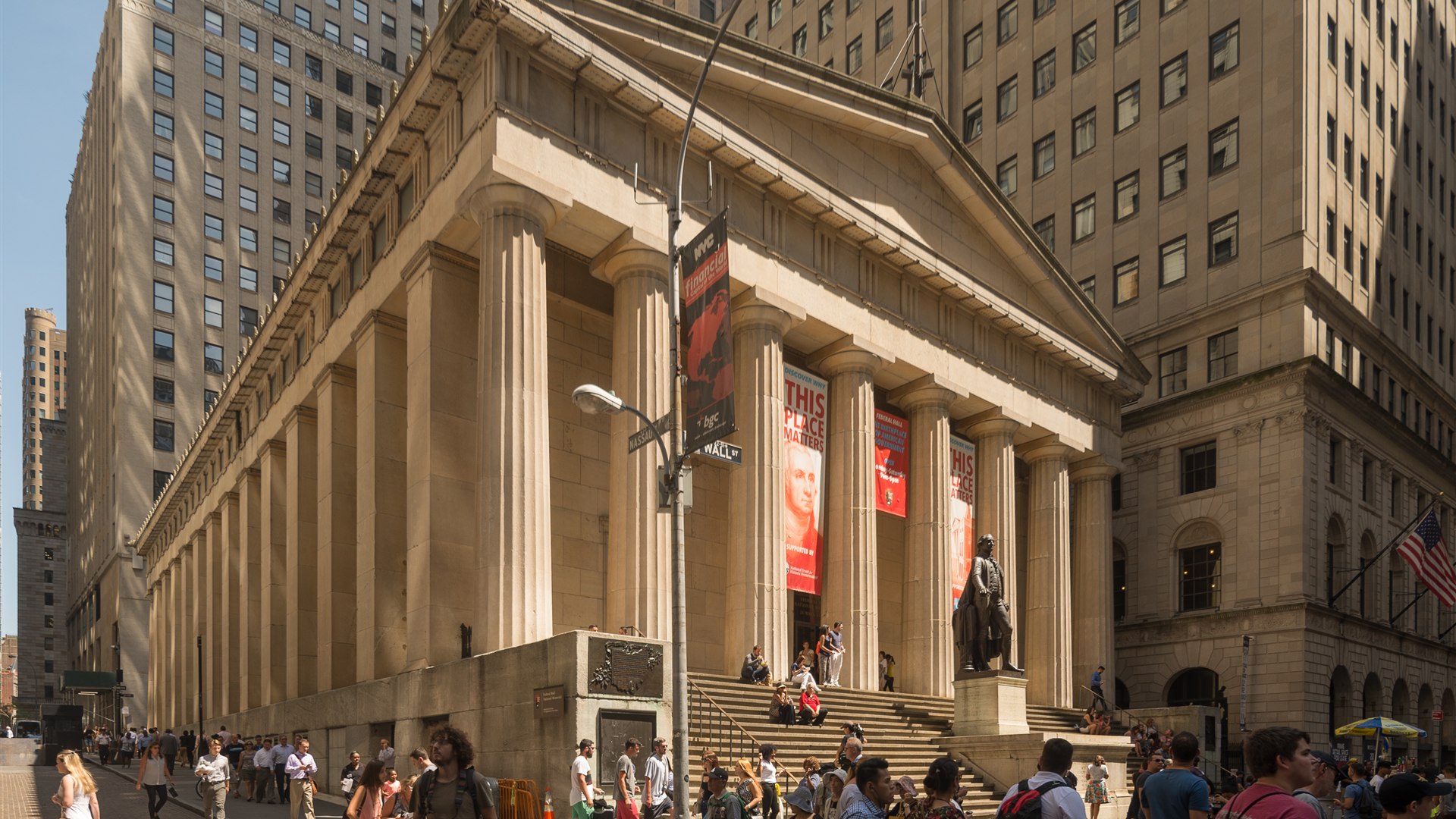 Federal Hall National Memorial on Wall Street with classical columns and George Washington statue