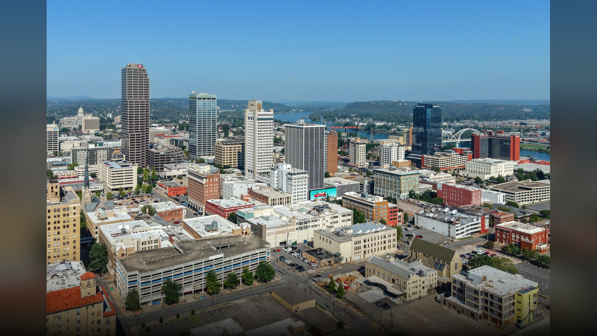Little Rock Arkansas downtown riverfront skyline overlooking the Arkansas River bridges.