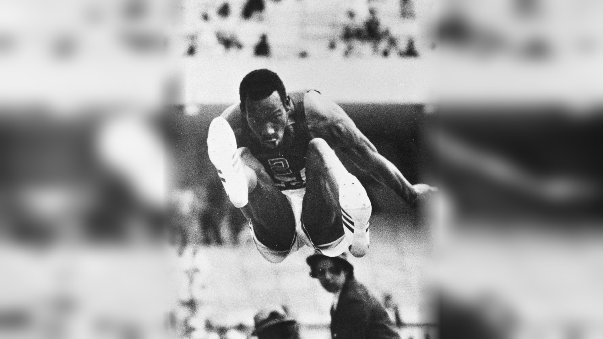Bob Beamon soaring through mid-air above the long jump sandpit at Mexico City 1968.