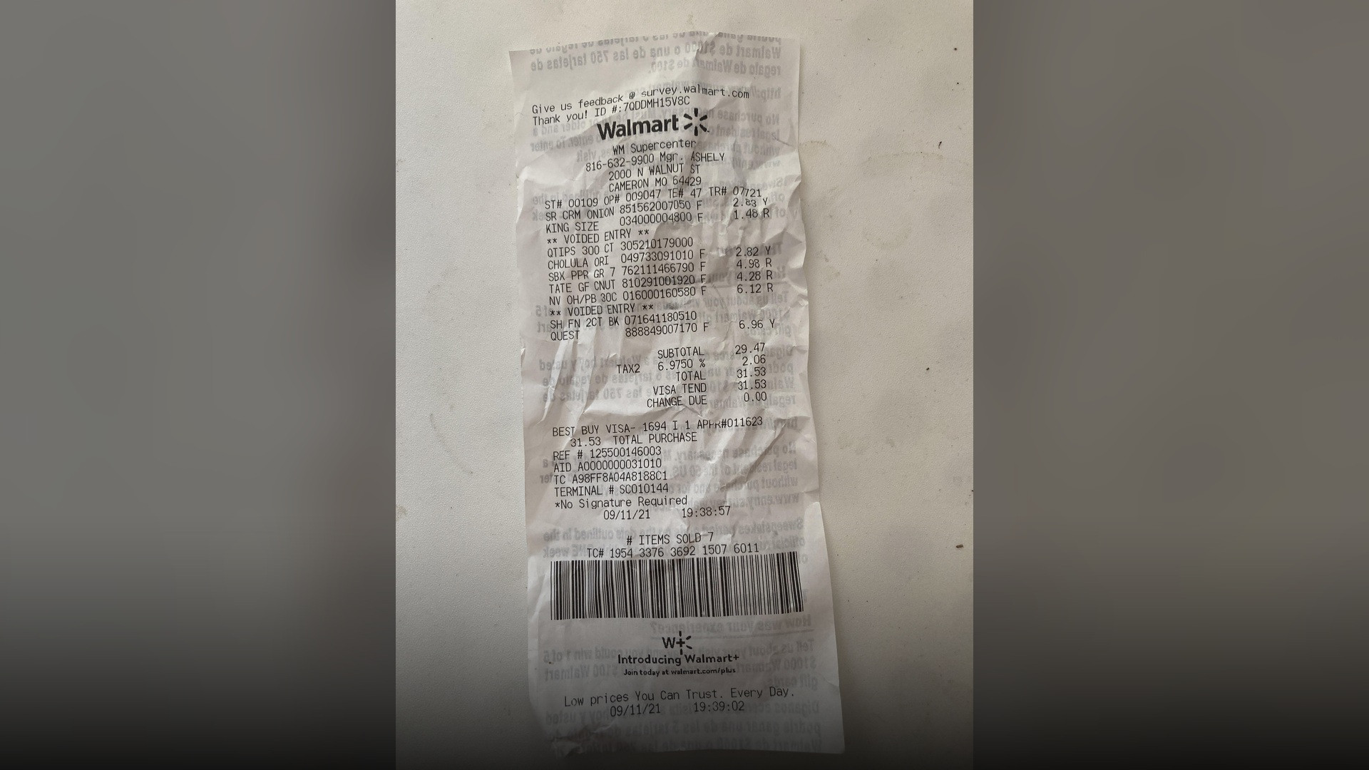 An itemized store receipt showing line-item sales tax added to the subtotal before reaching the final purchase total.
