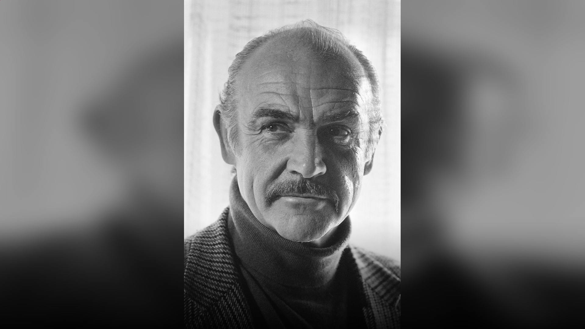 Sir Sean Connery in an elegant tailored tuxedo portrait.