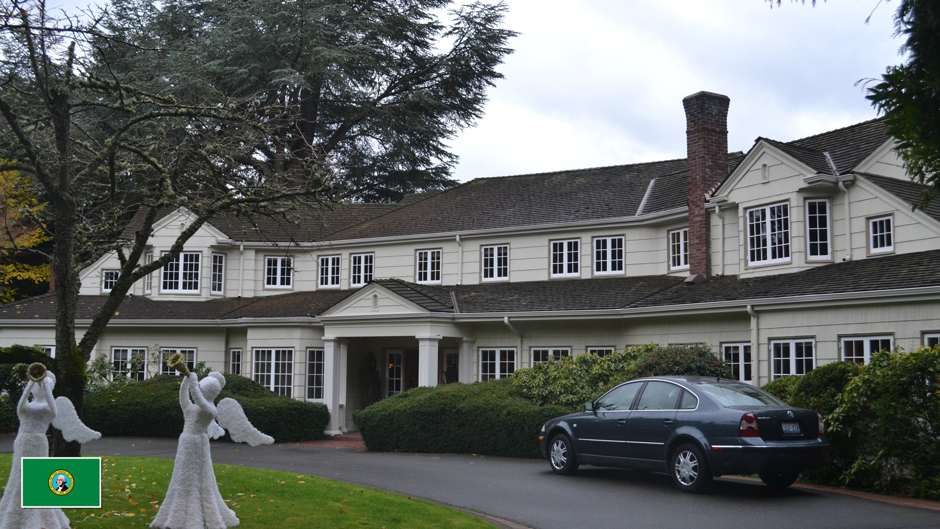 Medina, Lake Washington, Washington most expensive neighborhood estate with Washington state flag overlay in bottom-left corner