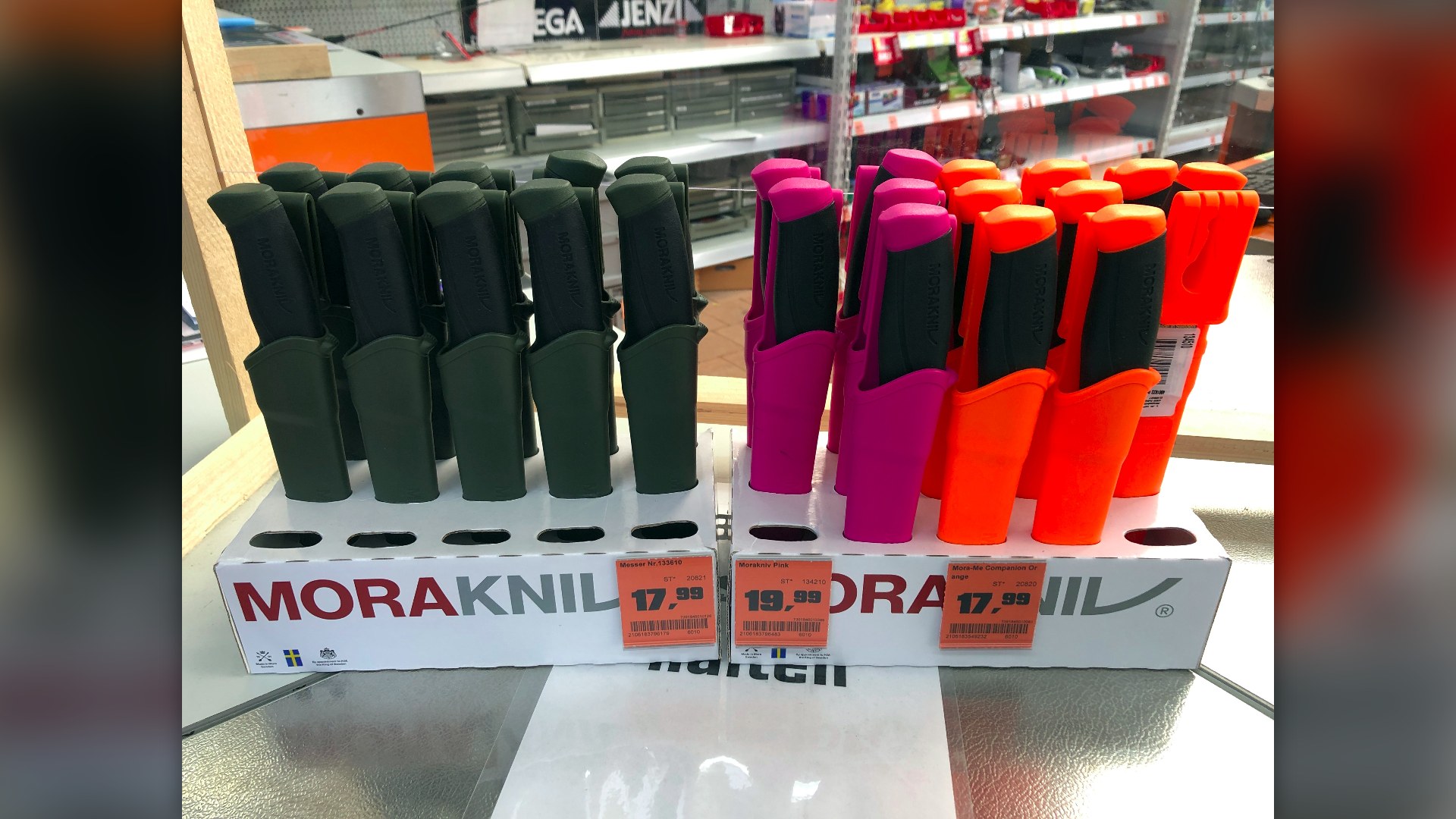 Retail store shelf pricing tags indicating tiered merchandise prices.