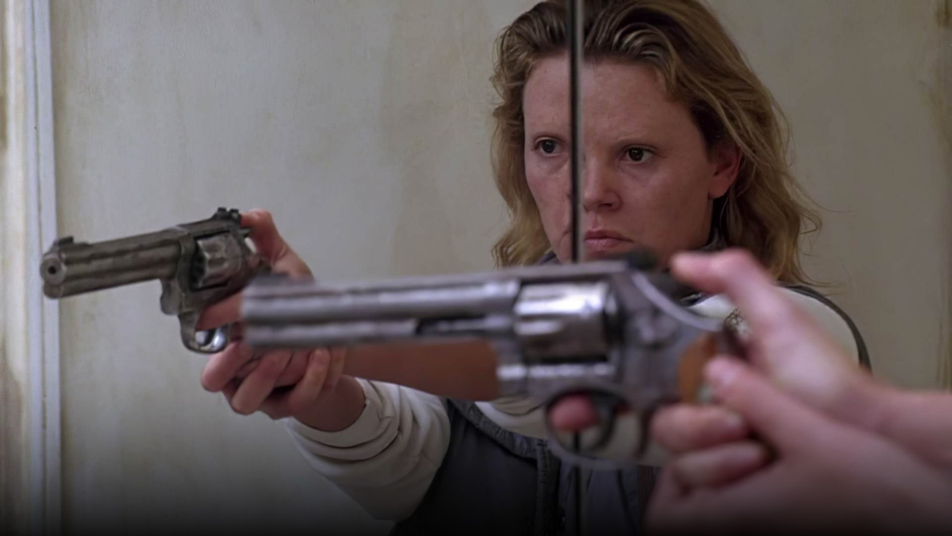 Charlize Theron transformed with prosthetic teeth and weight gain in Monster.