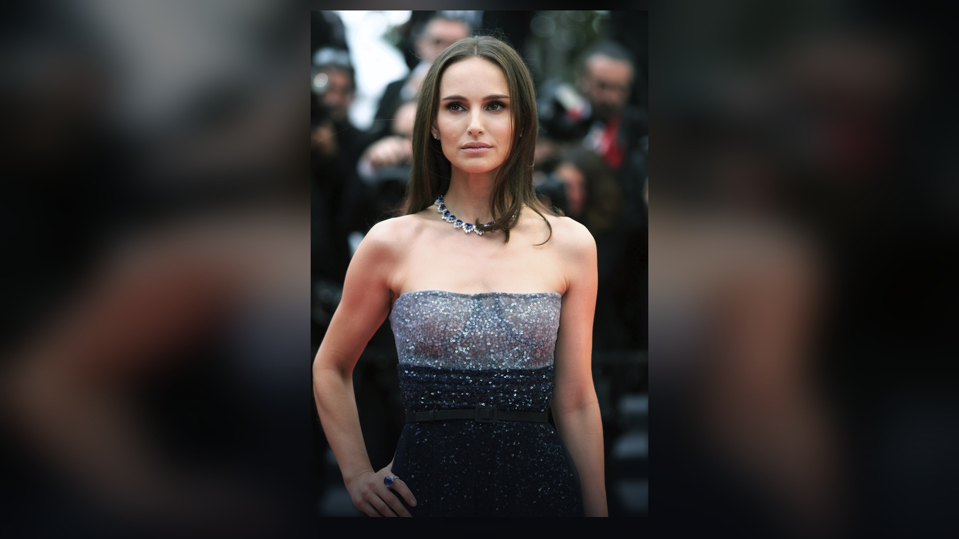 High-fashion red carpet portrait of Natalie Portman in a sequined gown