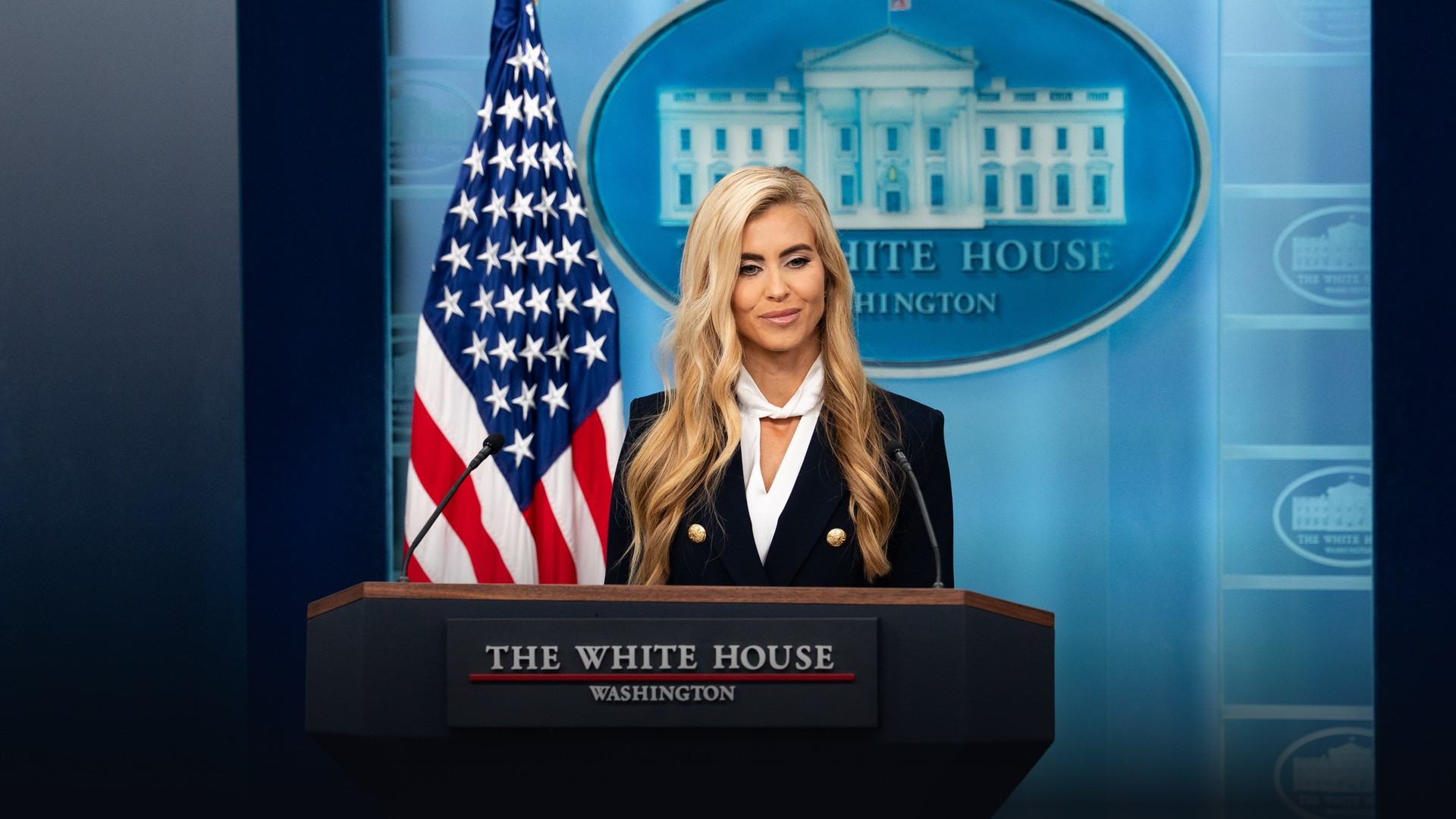 Official White House close-up photograph of Press Secretary Katie Zacharia standing at the James S. Brady Press Briefing Room podium on October 13, 2026.