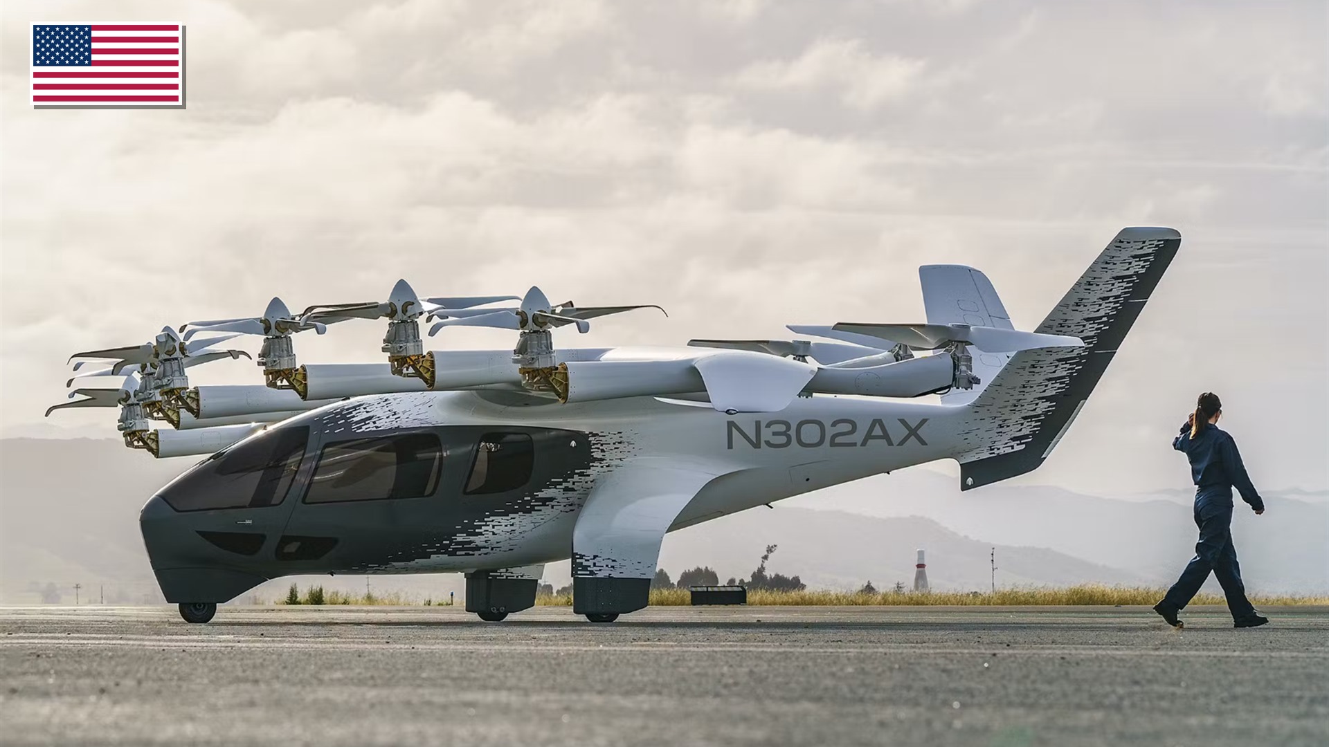 Archer Aviation Midnight 5-seat electric vertical takeoff and landing aircraft with the US flag in the top-left corner.