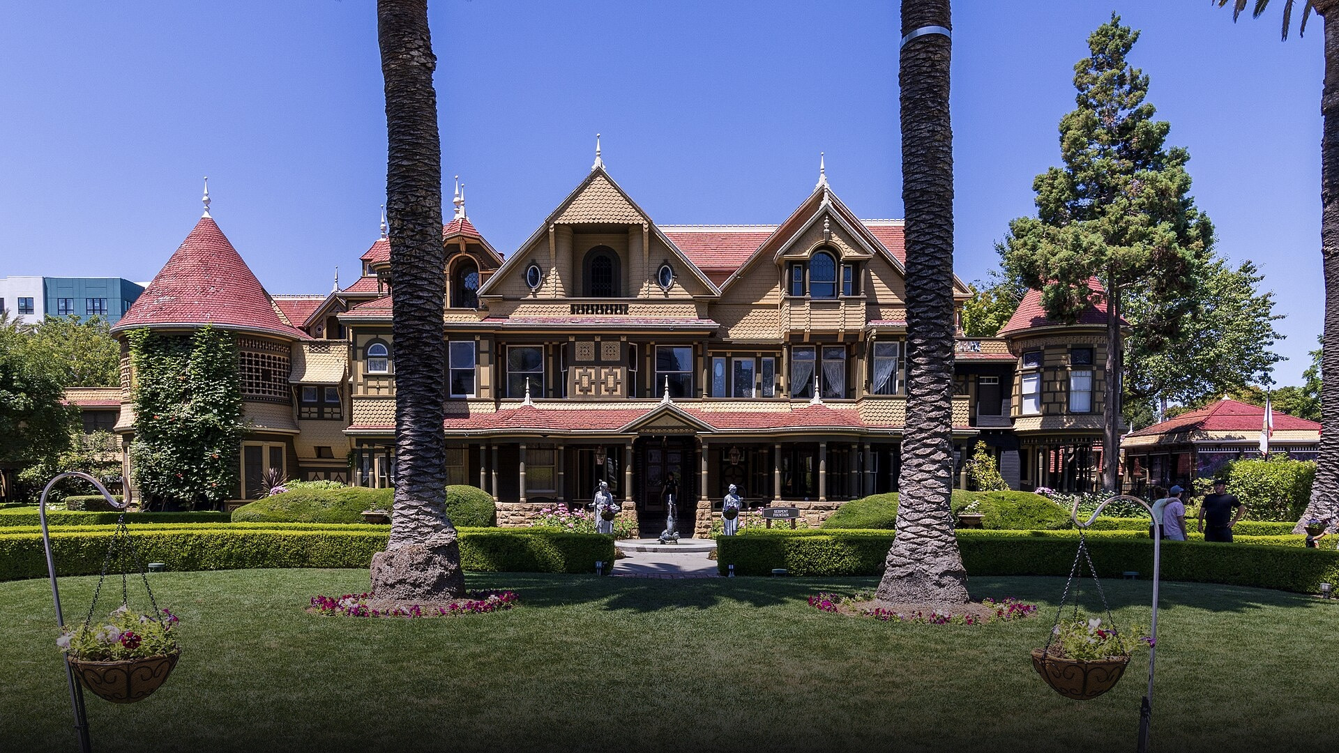 Intricate Queen Anne Victorian gables, cupolas, and turrets of the sprawling Winchester Mystery House in San Jose, California.