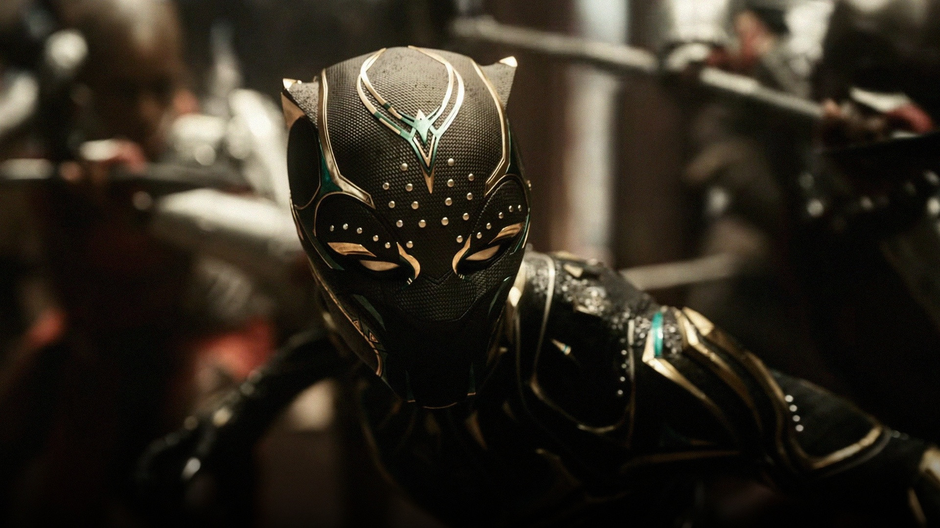 Letitia Wright as Shuri in gold-accented vibranium Black Panther habit with claws.
