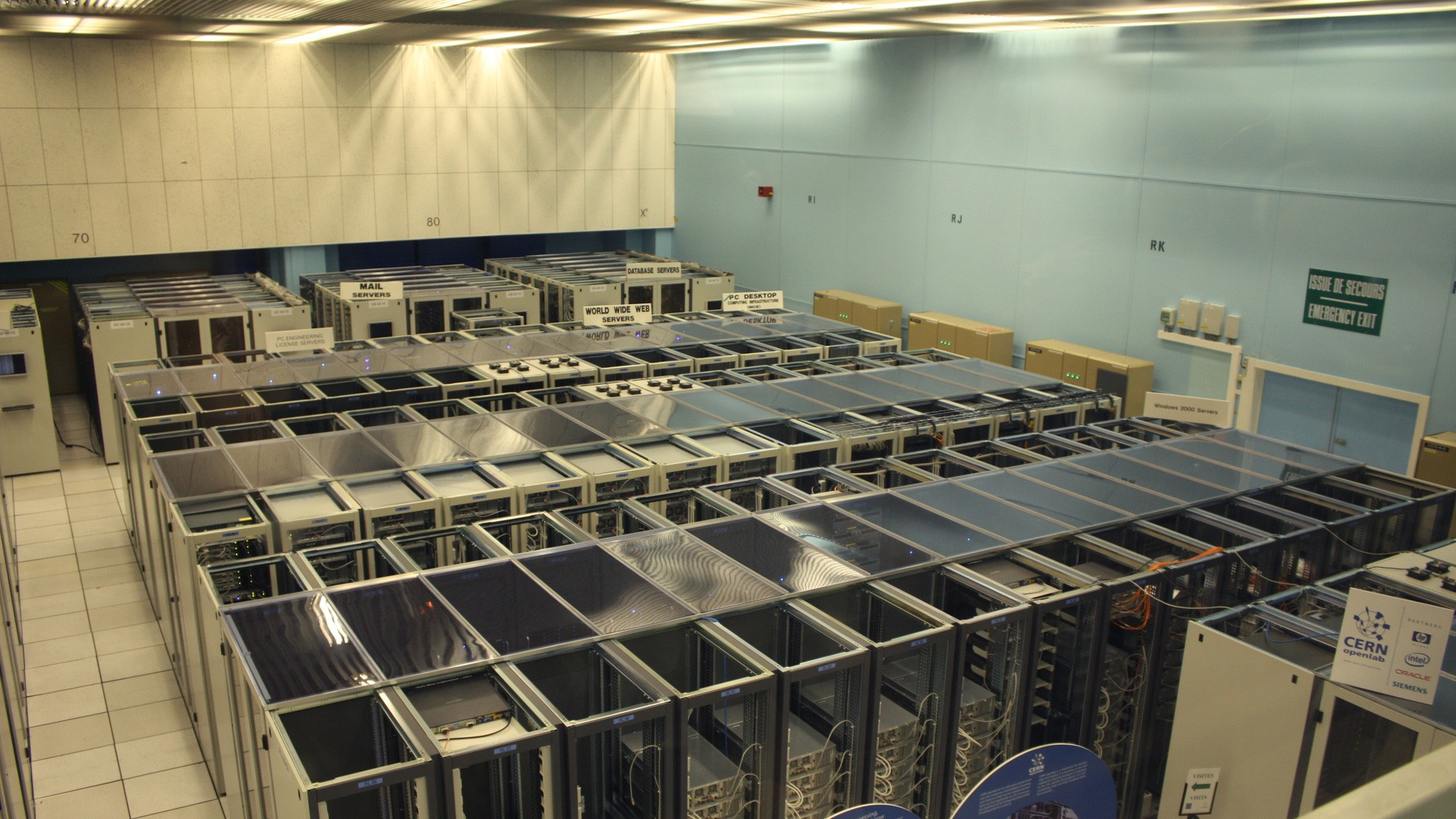 High-performance GPU server rack enclosure with glowing data cables in a datacenter.