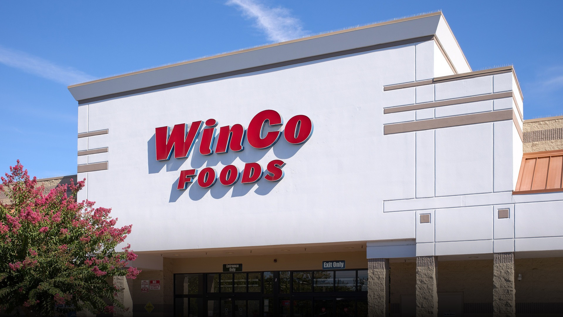 Photograph of WinCo Foods supermarket storefront celebrating family grocery excellence.