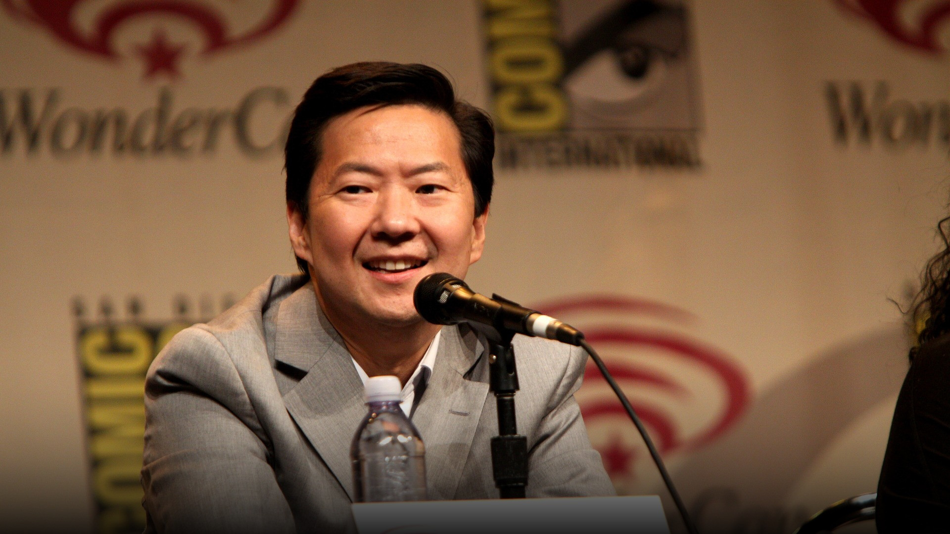 High-resolution portrait photograph of Ken Jeong celebrating academic achievement.