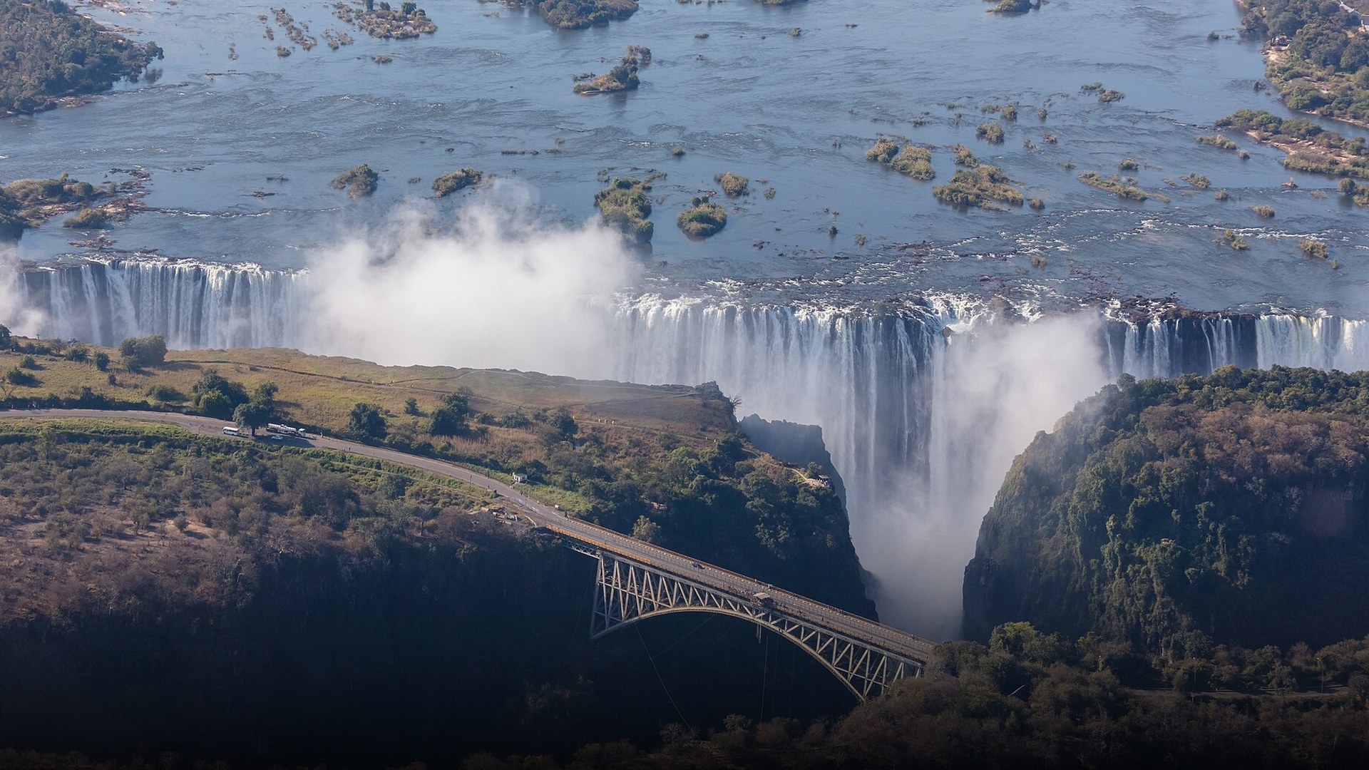 Thunderous white water cascades and basalt gorges of Victoria Falls viewed from the Zimbabwe side.
