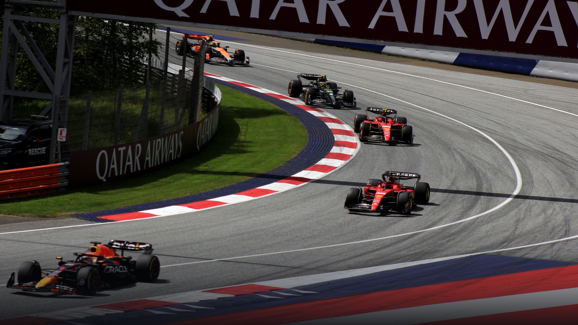 Max Verstappen leading the entire Formula 1 pack into Turn 1 during the Austrian Grand Prix.