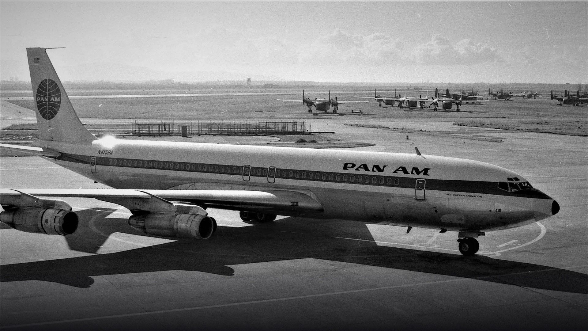 A vintage Pan American World Airways Boeing 707-121 parked on the airport tarmac at San Francisco in 1960.