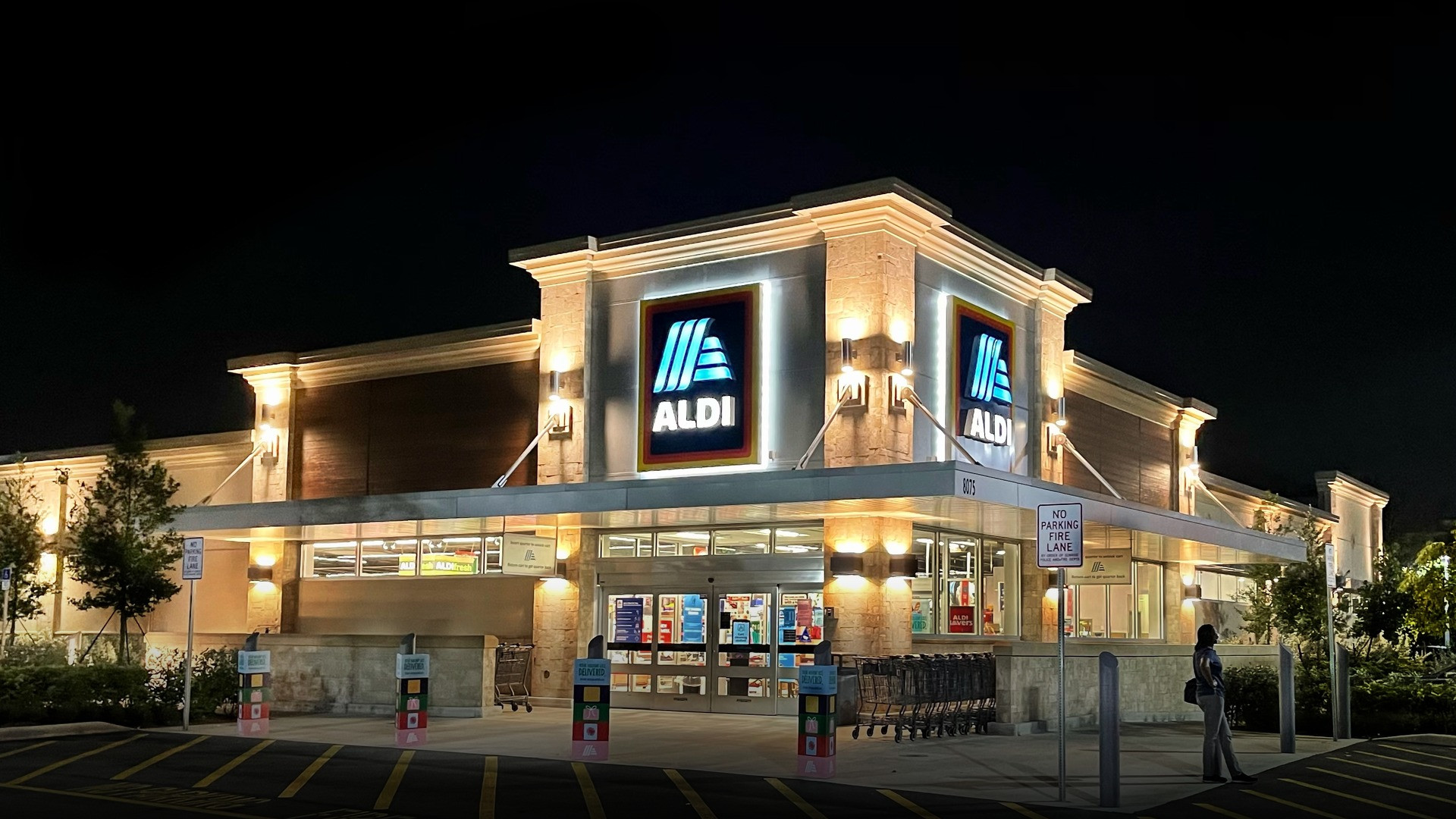 Photograph of Aldi supermarket storefront celebrating family grocery excellence.