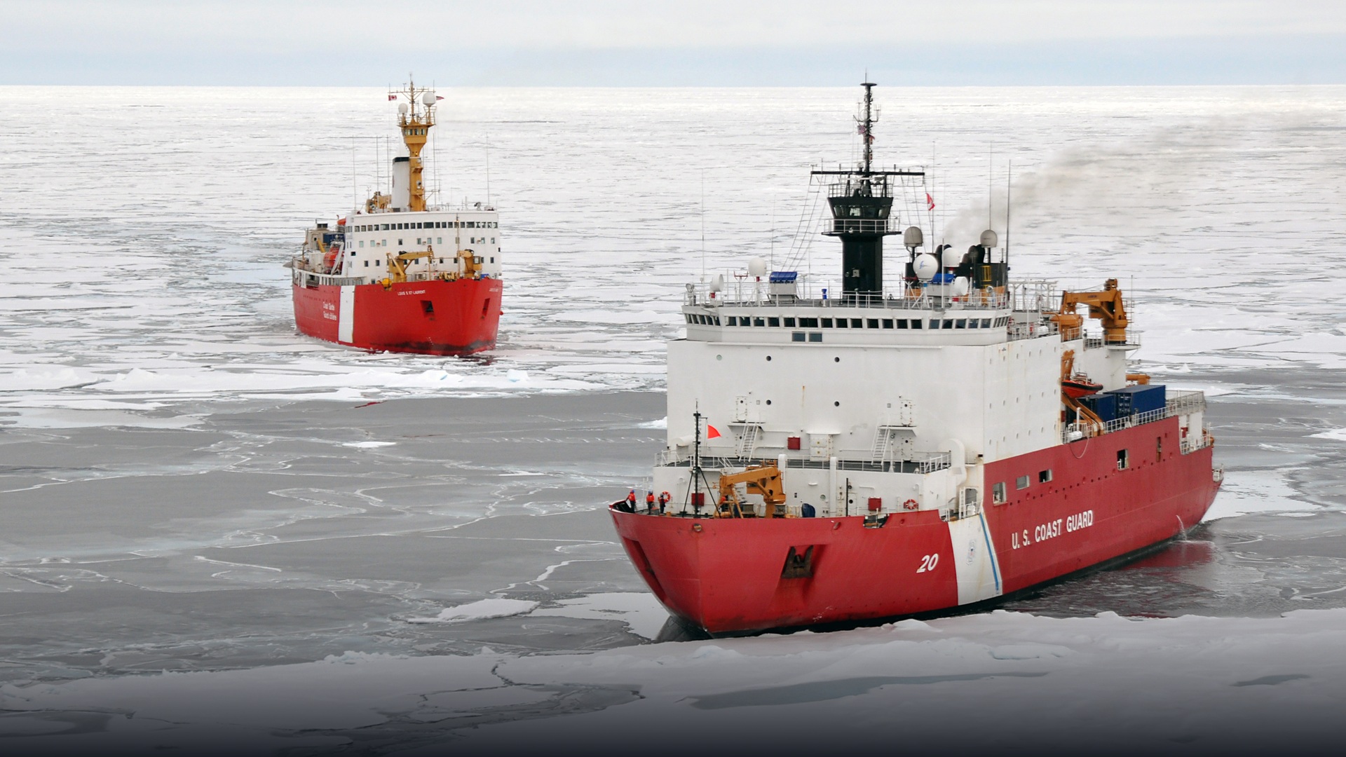 Heavy polar icebreaker cutting through thick sea ice in the Arctic Ocean.