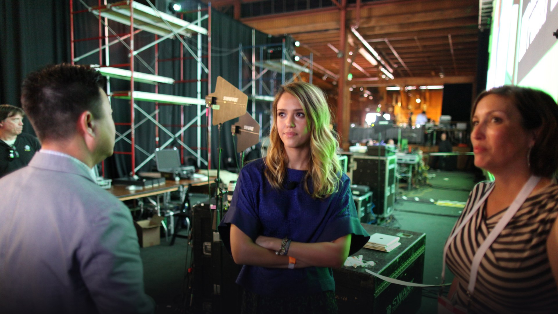 Jessica Alba speaking on stage as the founder and chairwoman of The Honest Company.