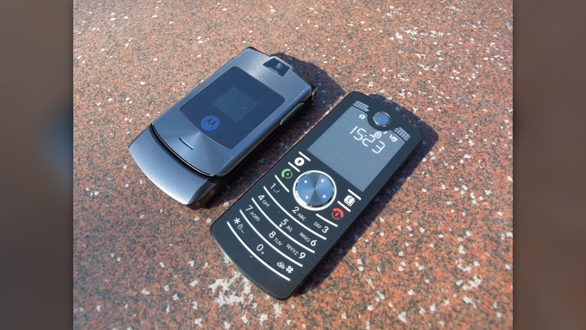 Motorola Razr V3i and Motorola F3 slim flip phones side by side