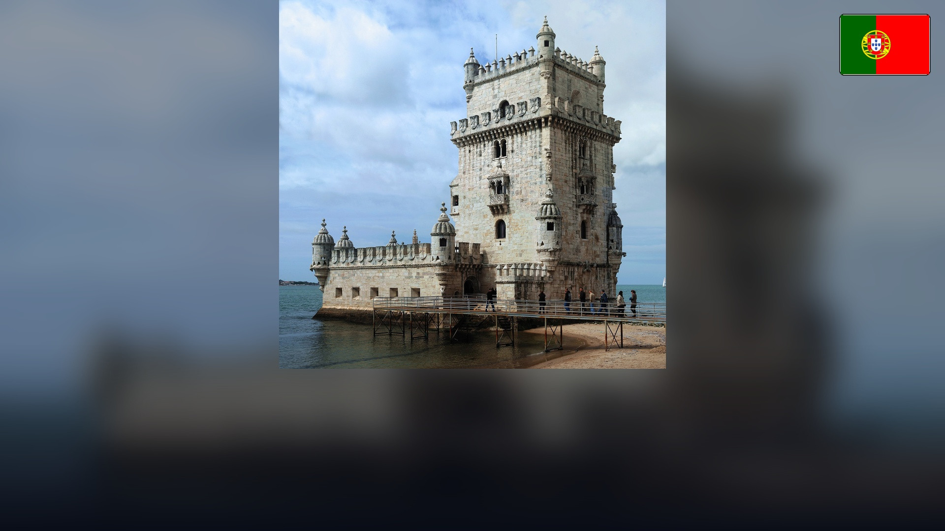 Belém Tower in Lisbon with the Portuguese flag in the top right corner.