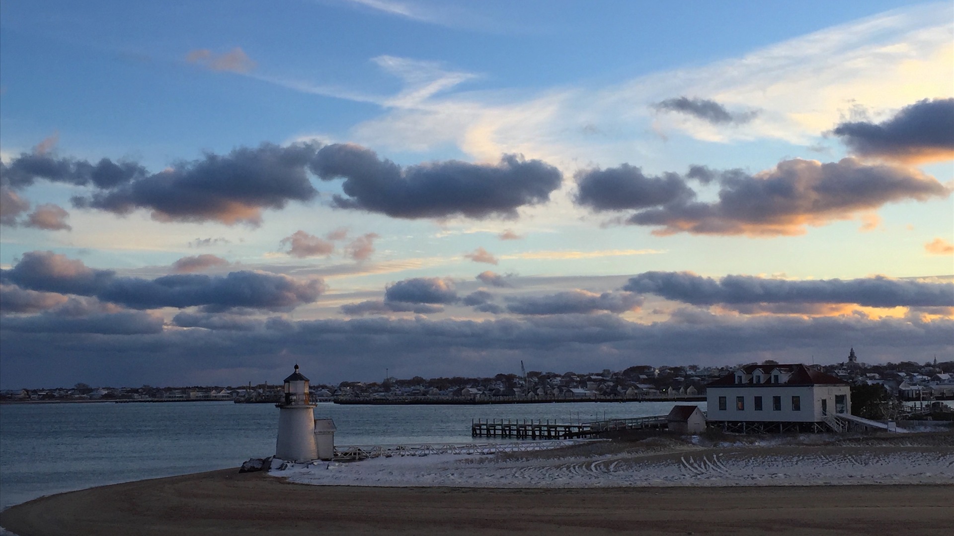Brant Point Lighthouse and wooden walkway at sunset on Nantucket Island, Massachusetts