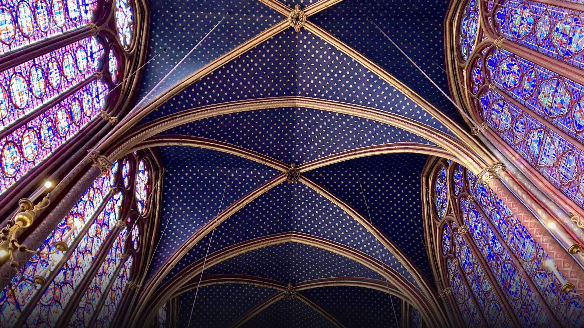 Spectacular towering Gothic stained-glass windows in the upper chapel of Sainte-Chapelle.