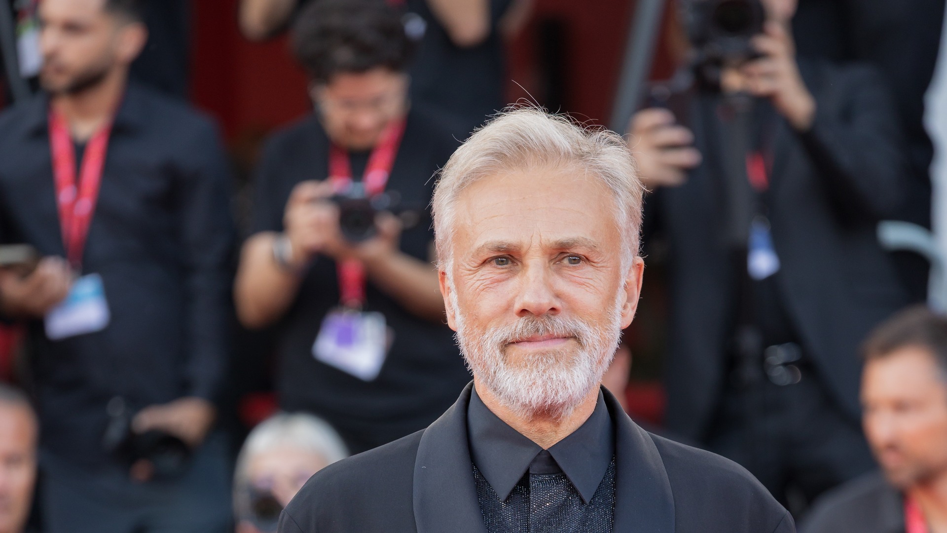 Austrian-German actor Christoph Waltz smiling at the Venice International Film Festival.